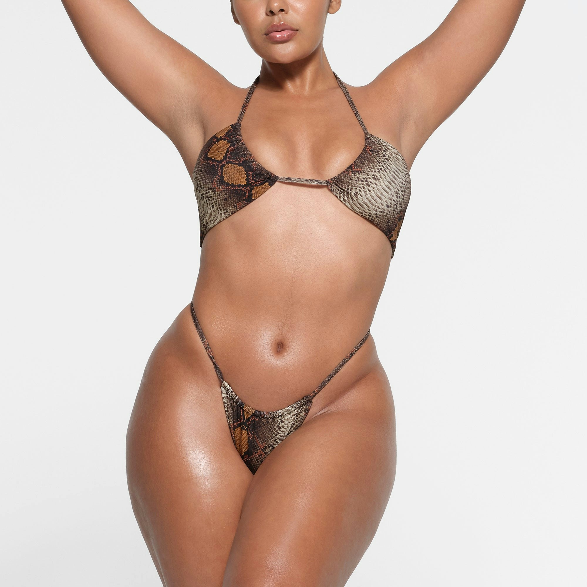 SIGNATURE SWIM STRING BIKINI BOTTOM | DESERT SNAKE PRINT ON A MODEL FRONT VIEW