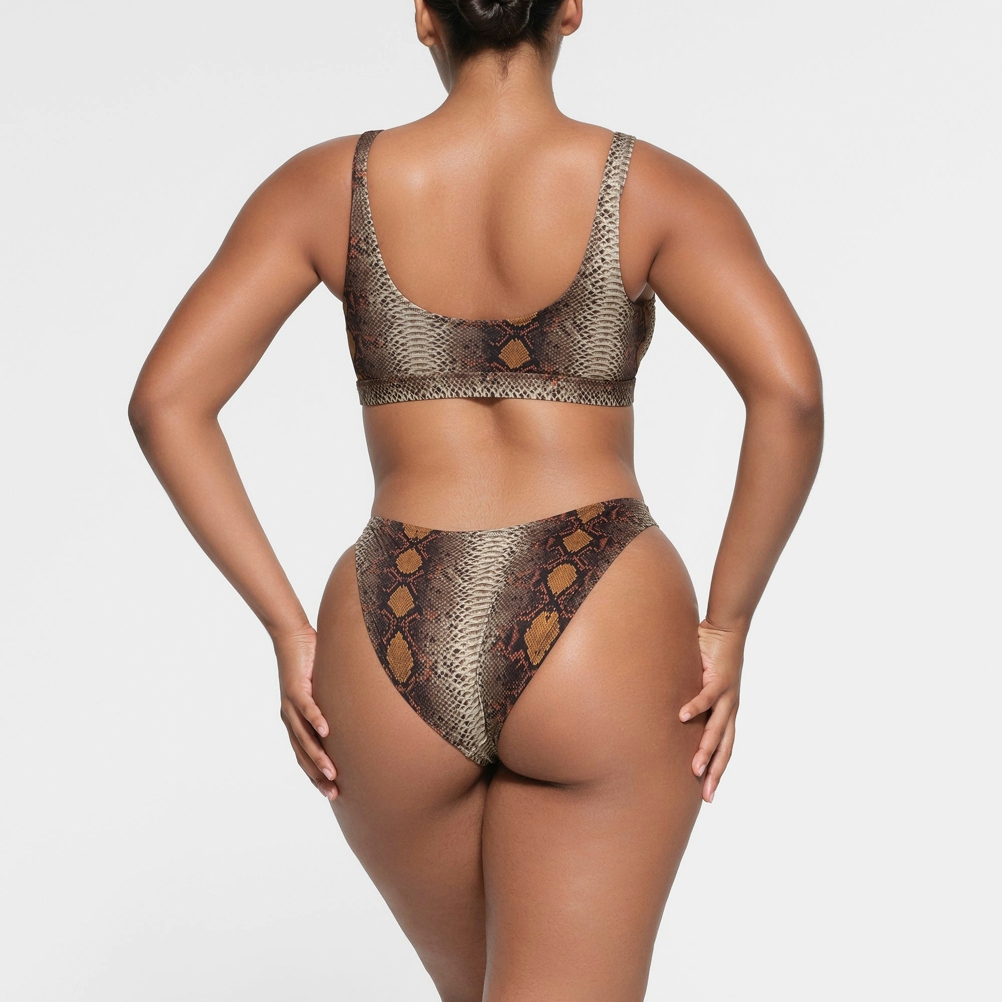 SIGNATURE SWIM MID COVERAGE BOTTOM | DESERT SNAKE PRINT ON A MODEL BACK VIEW