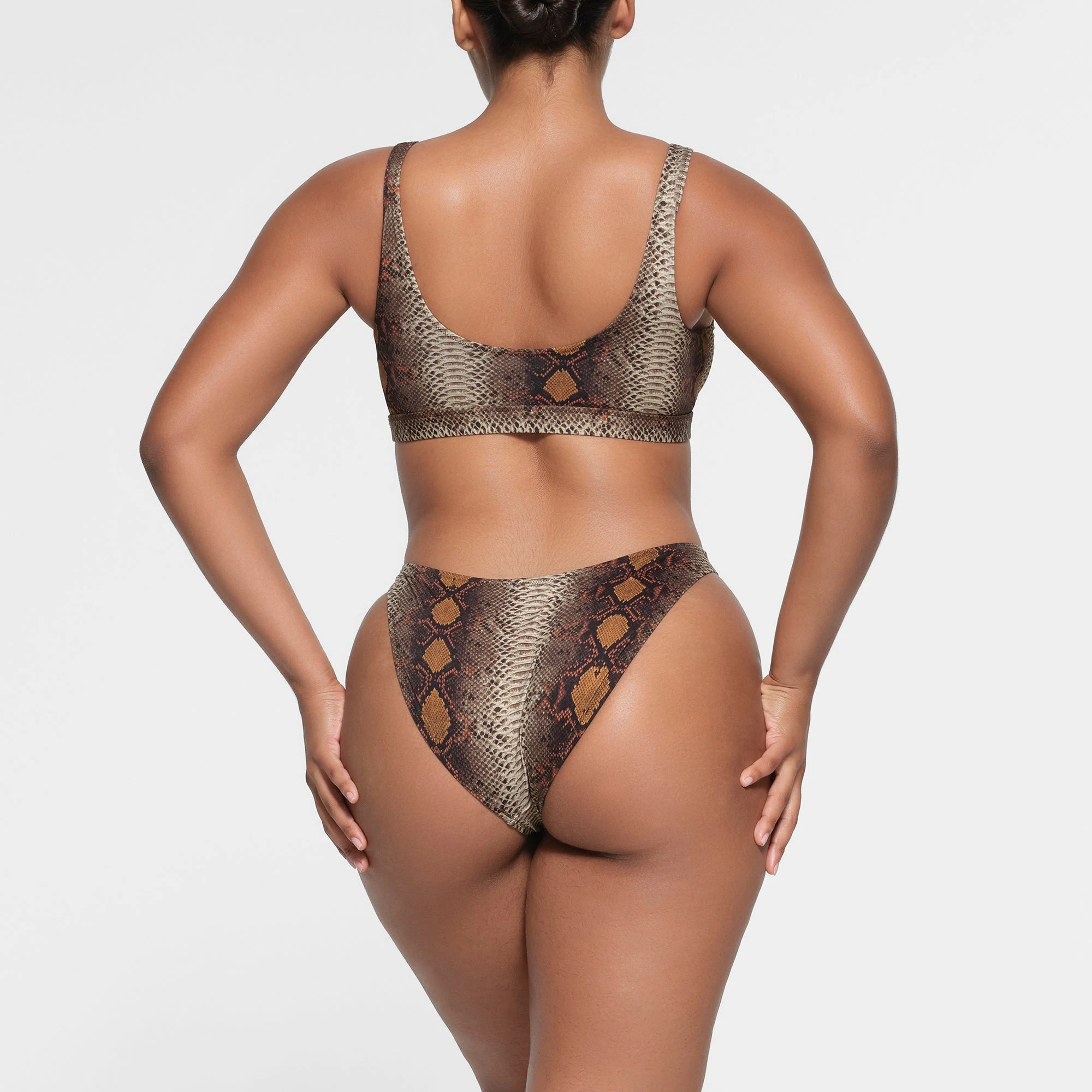 SIGNATURE SWIM MID COVERAGE BOTTOM | DESERT SNAKE PRINT ON A MODEL BACK VIEW