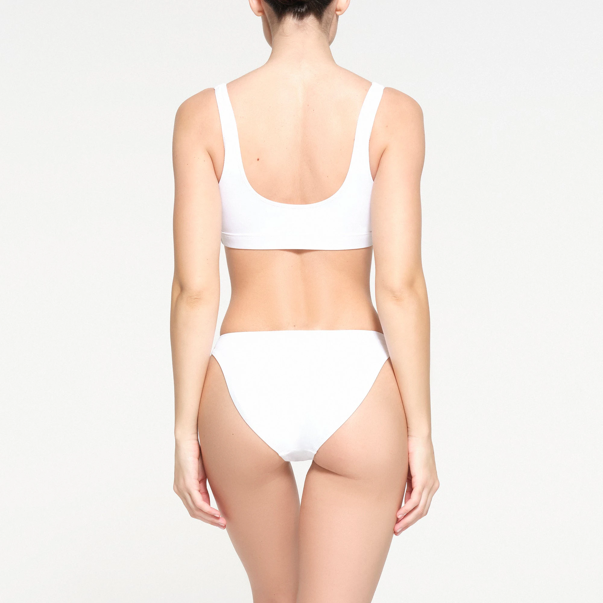 SIGNATURE SWIM MID COVERAGE BOTTOMS | SNOW ON A MODEL BACK VIEW