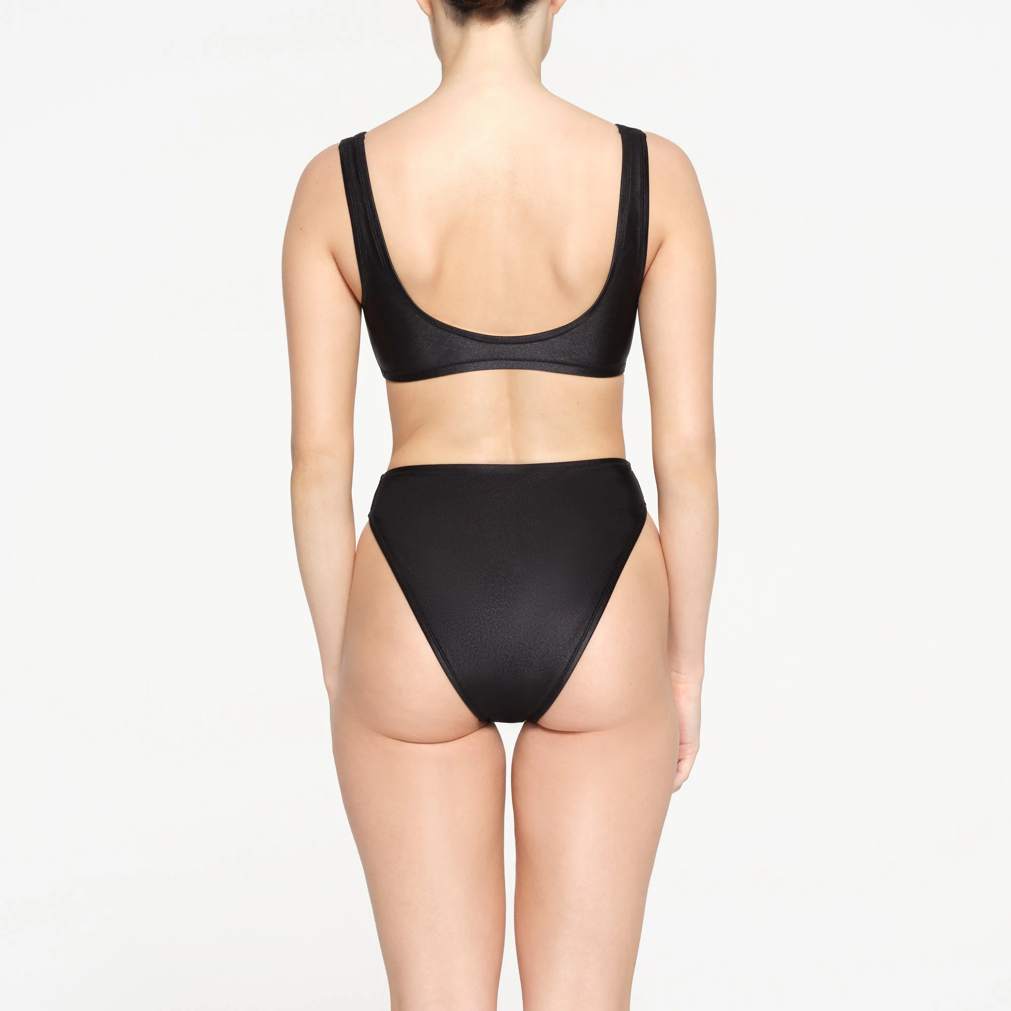 SHINE SWIM MID WAIST BOTTOMS | ONYX ON A MODEL BACK VIEW