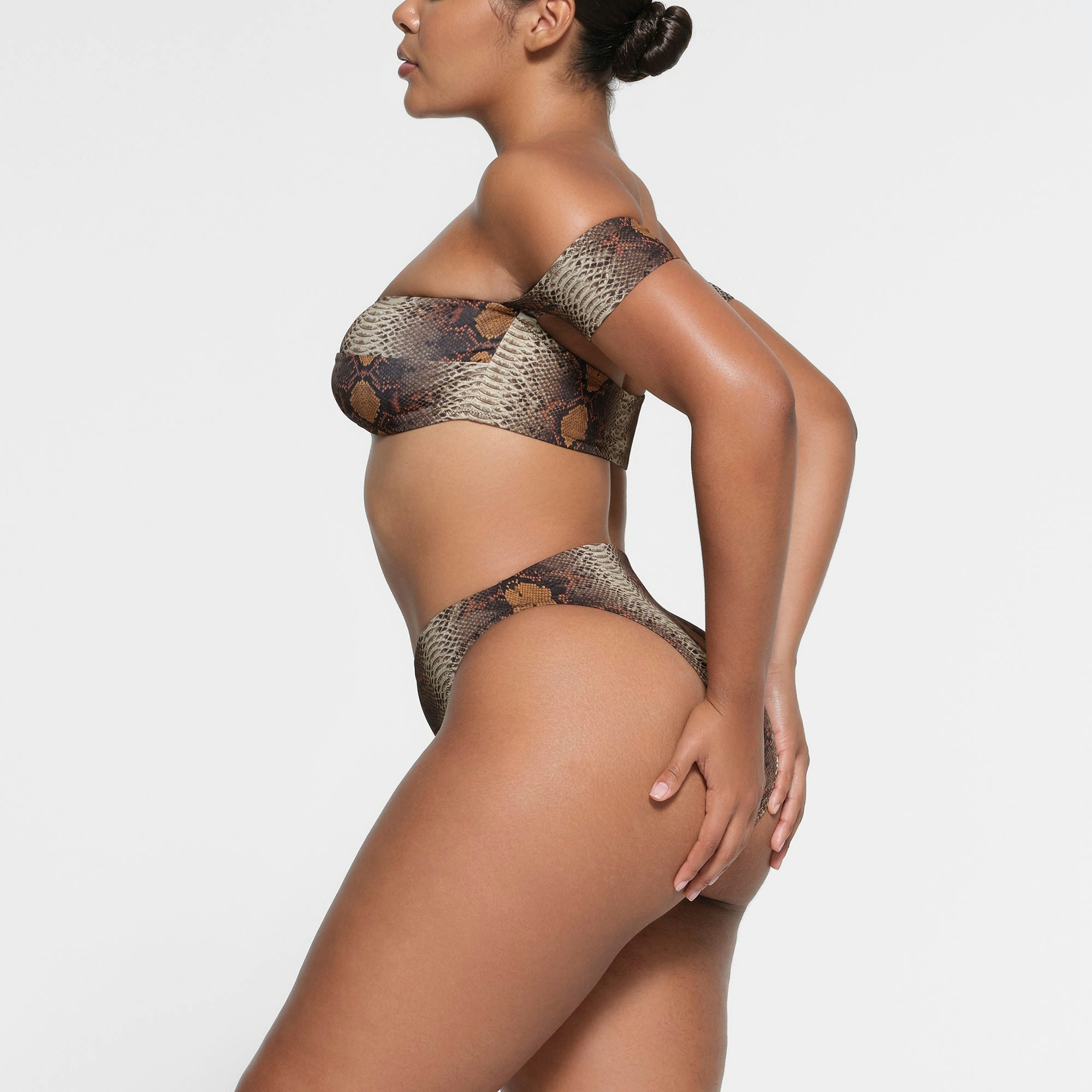 SIGNATURE SWIM HIGH LEG BIKINI BOTTOM | DESERT SNAKE PRINT ON A MODEL SIDE VIEW