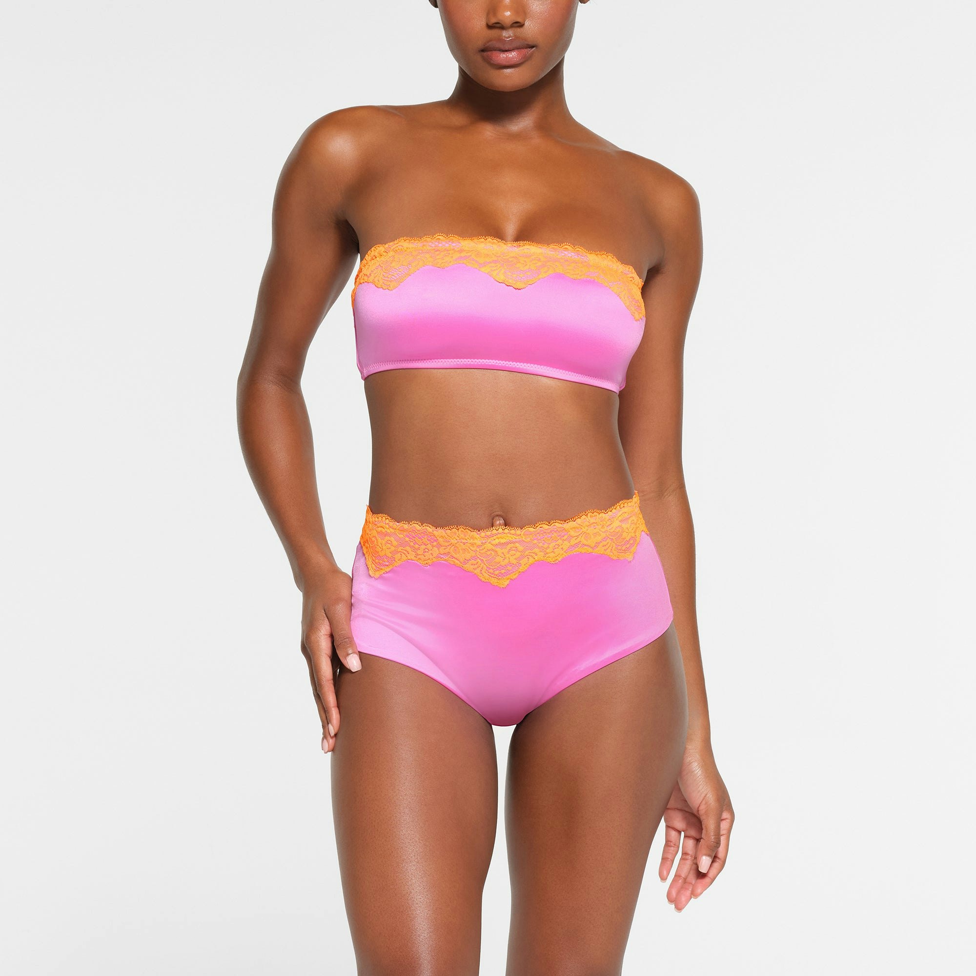 LACE SWIM HIGH-WAISTED BRIEF | NEON ORCHID ON A MODEL FRONT VIEW