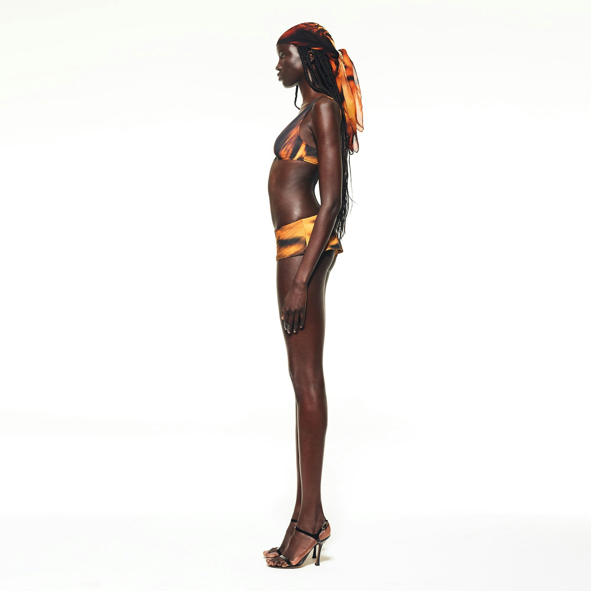 ROBERTO CAVALLI X SKIMS MICRO SKIRT BIKINI BOTTOM | TIGER FACE PRINT ON A MODEL SIDE VIEW | FOCUS: 0.0, 1.0, 0.9