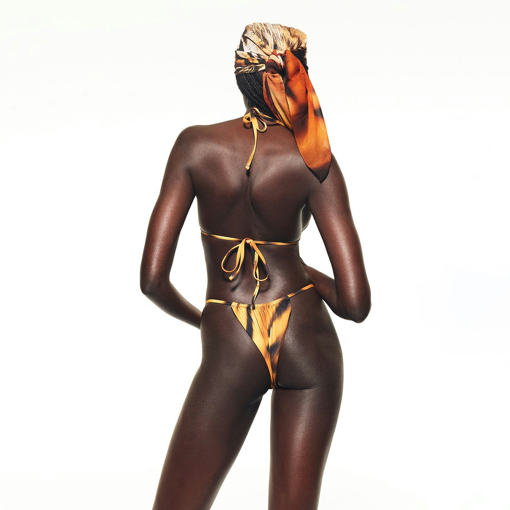 ROBERTO CAVALLI X SKIMS STRING BIKINI BOTTOM | TIGER FACE PRINT ON A MODEL BACK VIEW | FOCUS: 0.0, 1.0, 0.9