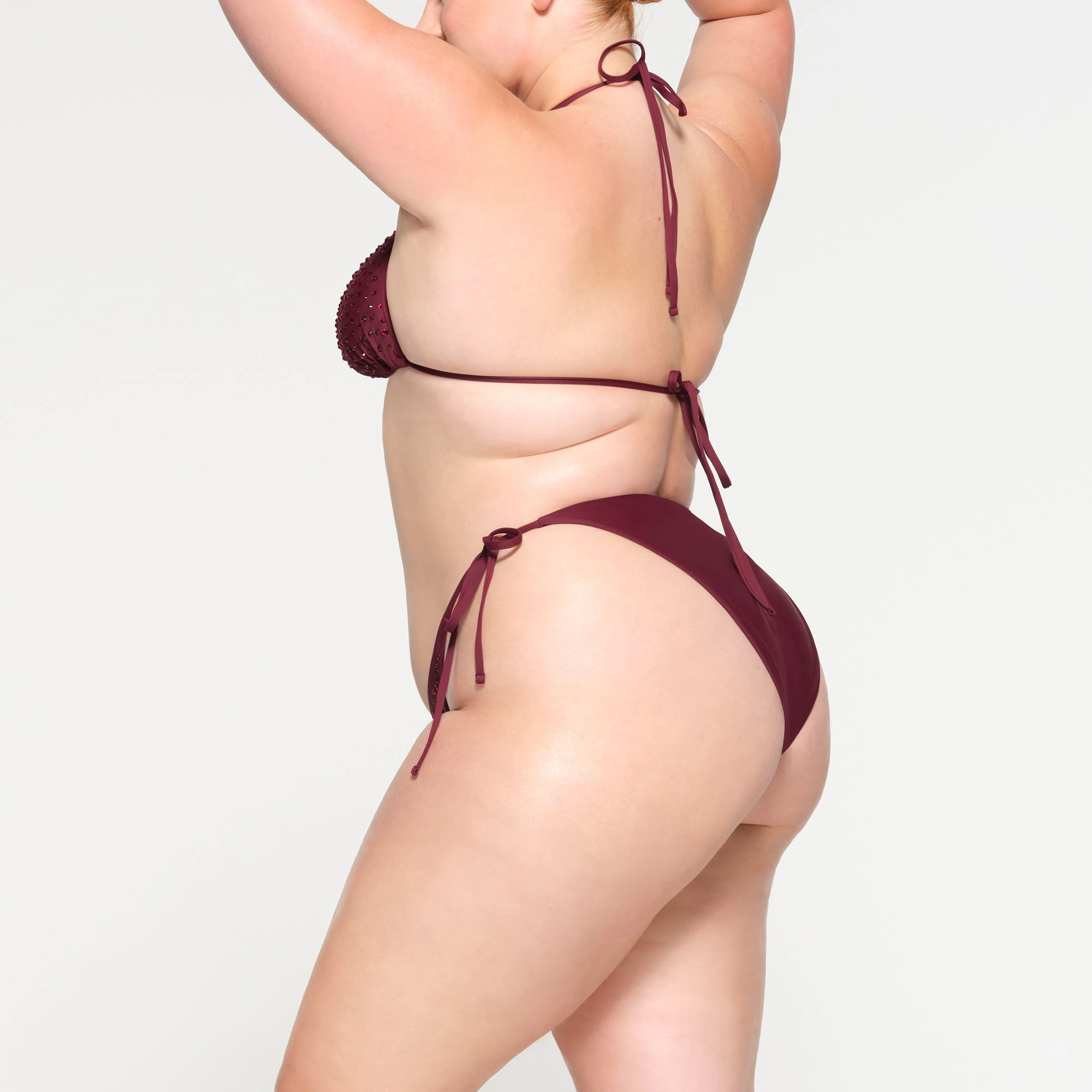 RHINESTONE TIE BIKINI BOTTOMS WORN BY A MODEL IN SIDE VIEW