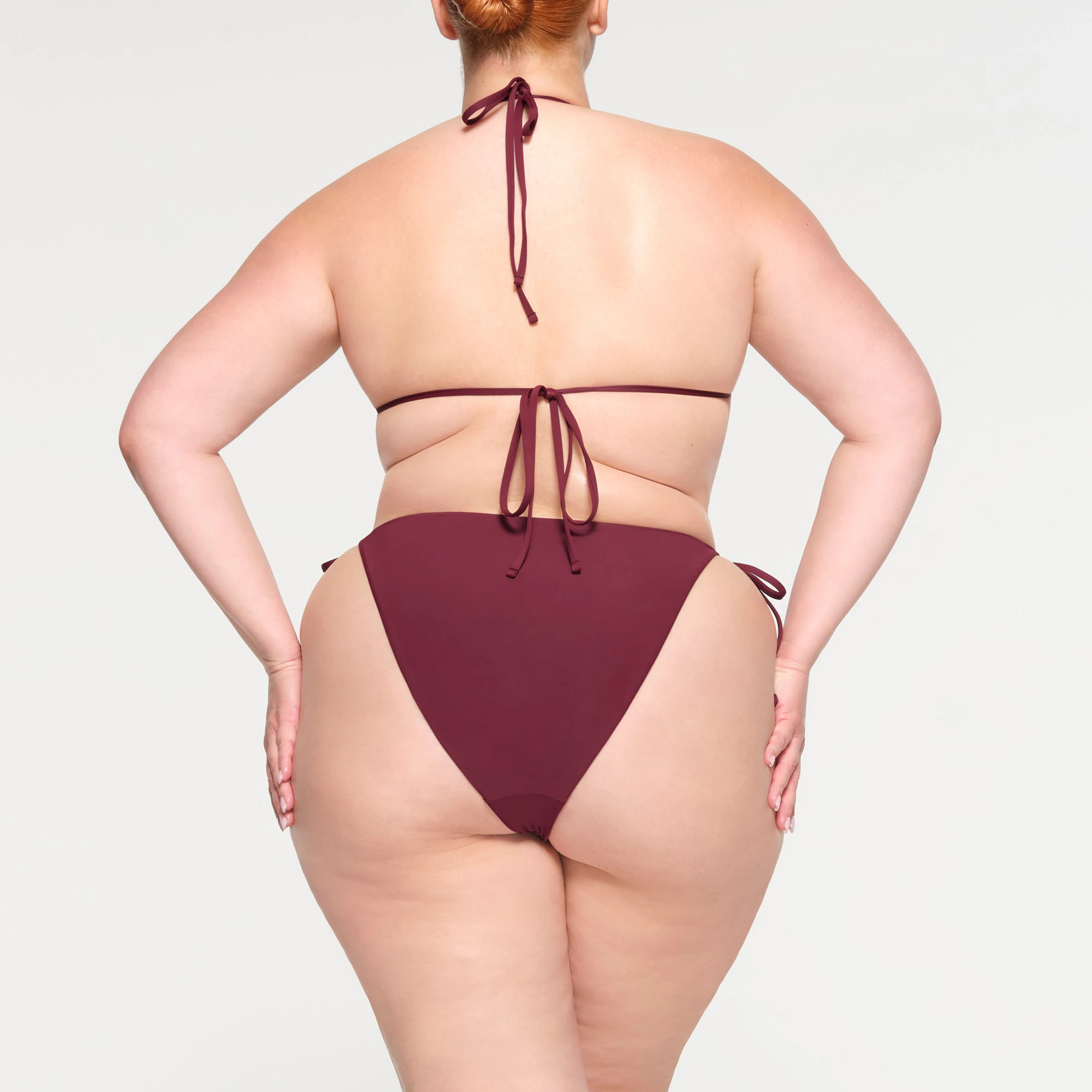 RHINESTONE TIE BIKINI BOTTOMS ON A MODEL BACK VIEW