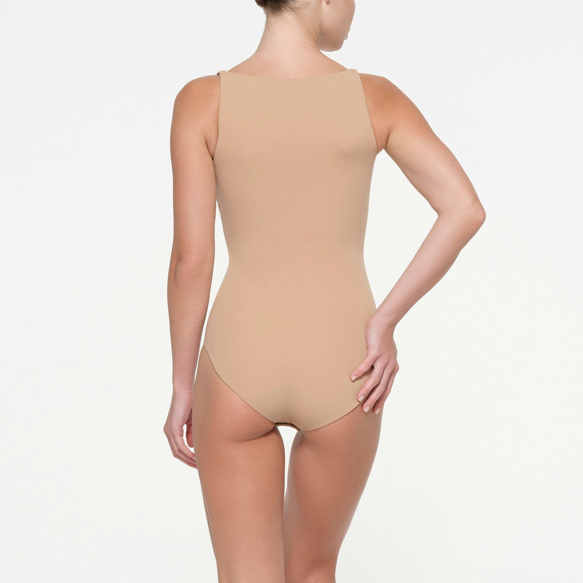 FITS EVERYBODY FULL COVERAGE BACK SMOOTHER BRIEF BODYSUIT | CLAY ON A MODEL BACK VIEW