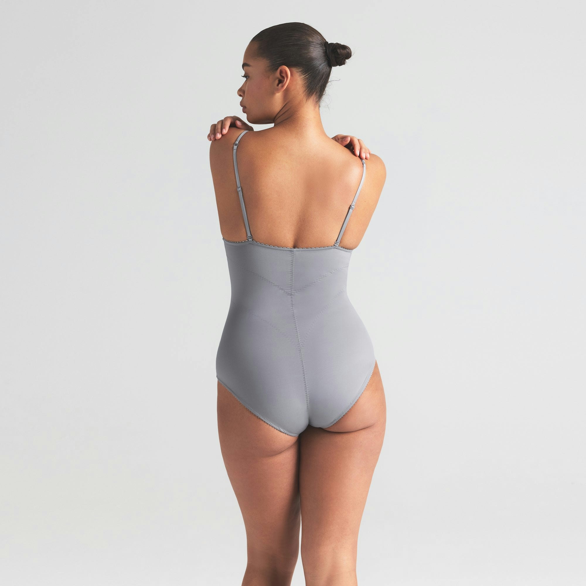 VINTAGE SHAPEWEAR BRIEF BODYSUIT | SHADOW ON A MODEL SIDE VIEW | FOCUS: 0.0, 1.0, 0.9