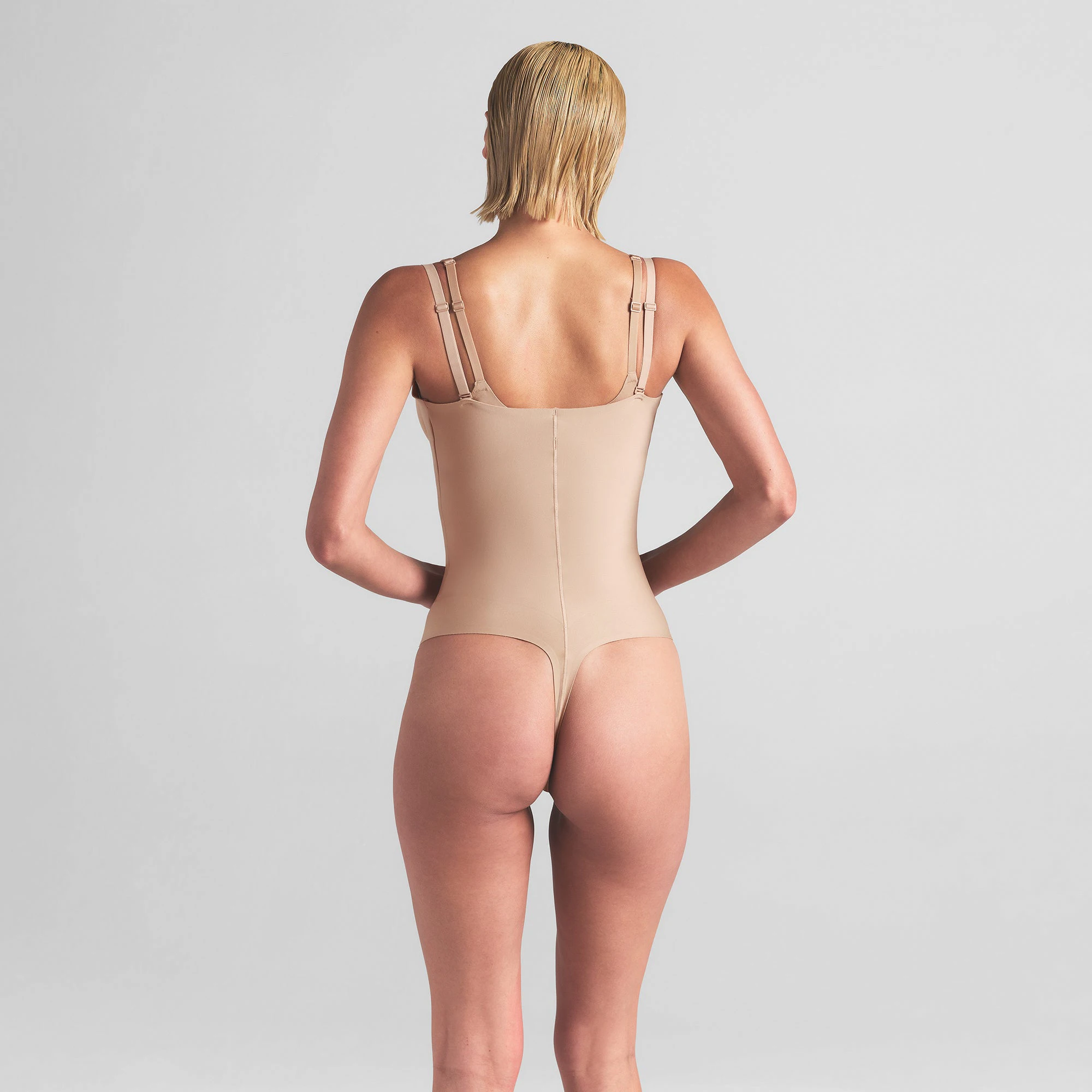 SKIMS BODY CORE SCULPT OPEN BUST THONG BODYSUIT | CLAY ON A MODEL BACK VIEW | FOCUS: 0.0, 1.0, 0.9