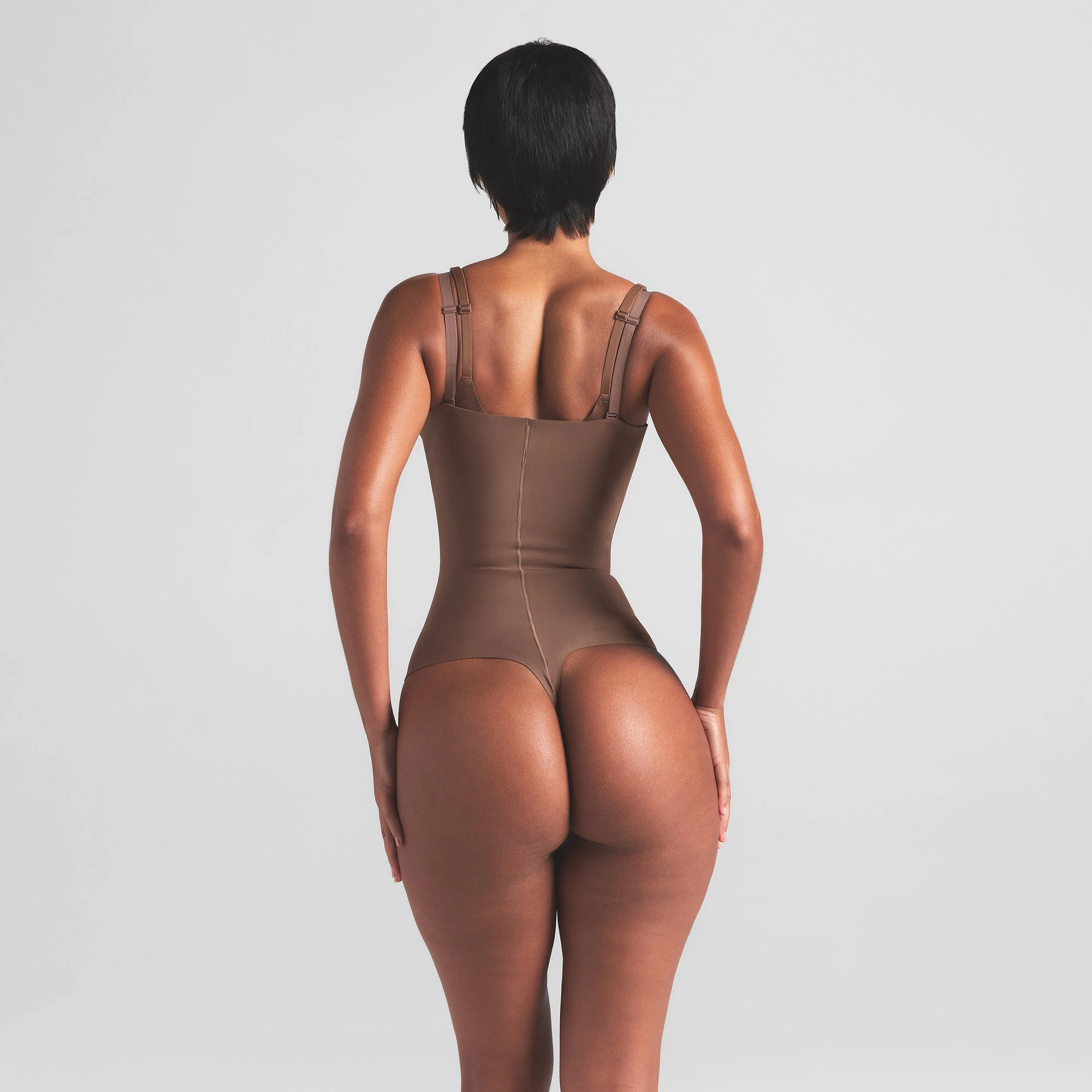 SKIMS BODY CORE SCULPT OPEN BUST THONG BODYSUIT | JASPER ON A MODEL BACK VIEW | FOCUS: 0.0, 1.0, 0.9