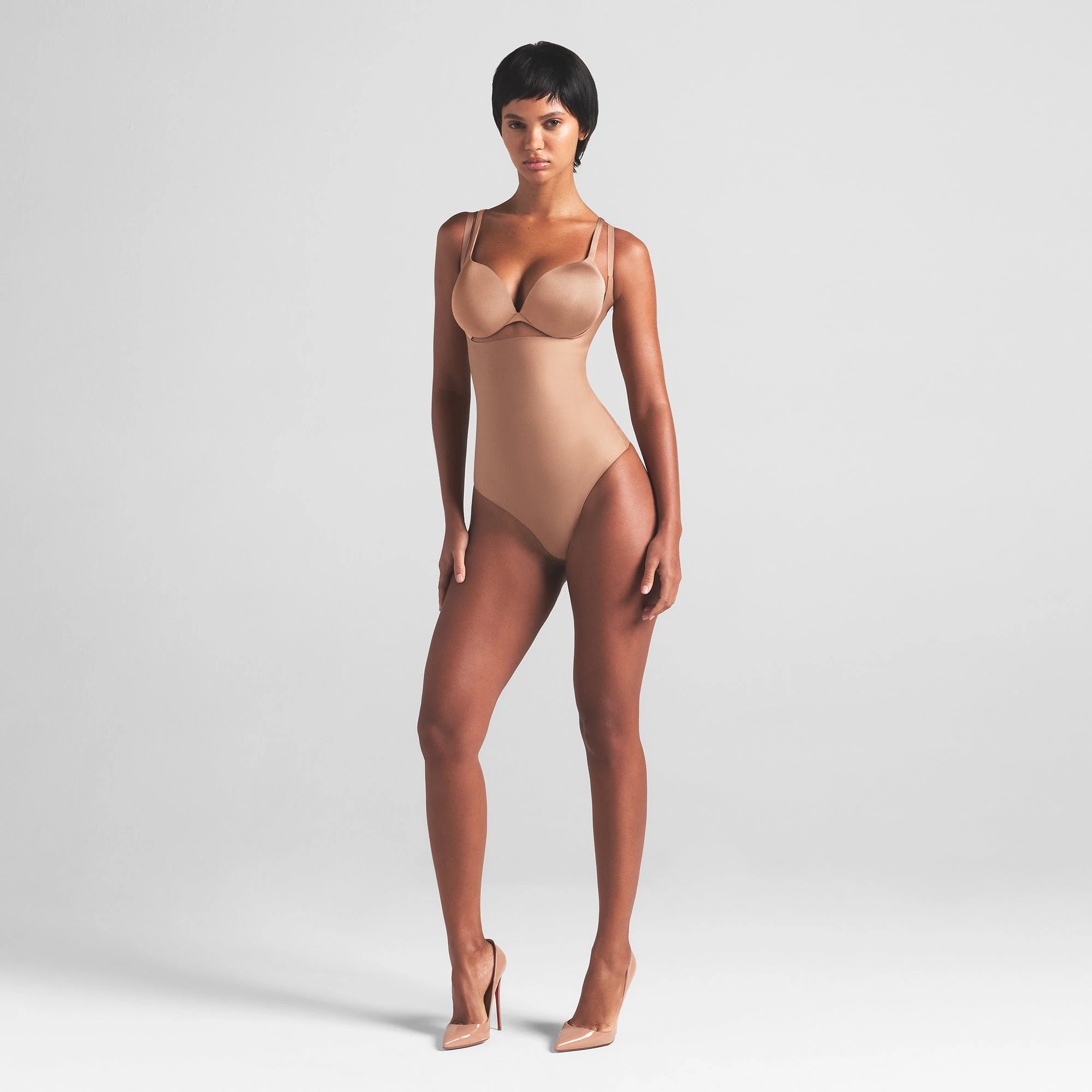 SKIMS BODY CORE SCULPT OPEN BUST THONG BODYSUIT | SIENNA ON A MODEL FRONT VIEW | FOCUS: 0.0, 1.0, 0.9