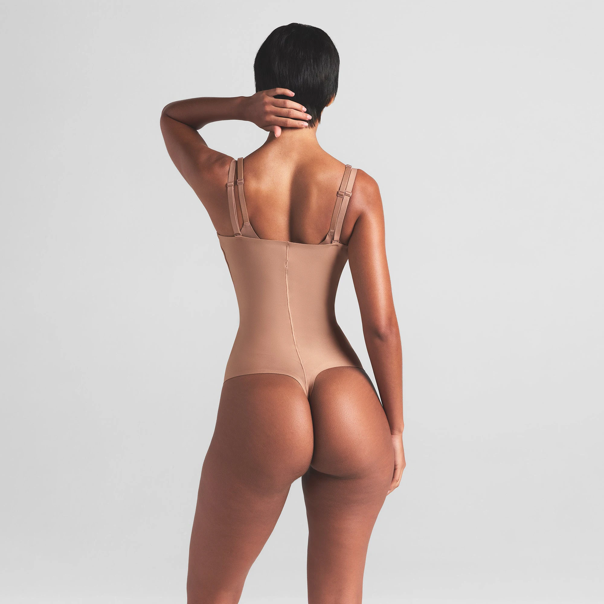 SKIMS BODY CORE SCULPT OPEN BUST THONG BODYSUIT | SIENNA ON A MODEL BACK VIEW | FOCUS: 0.0, 1.0, 0.9