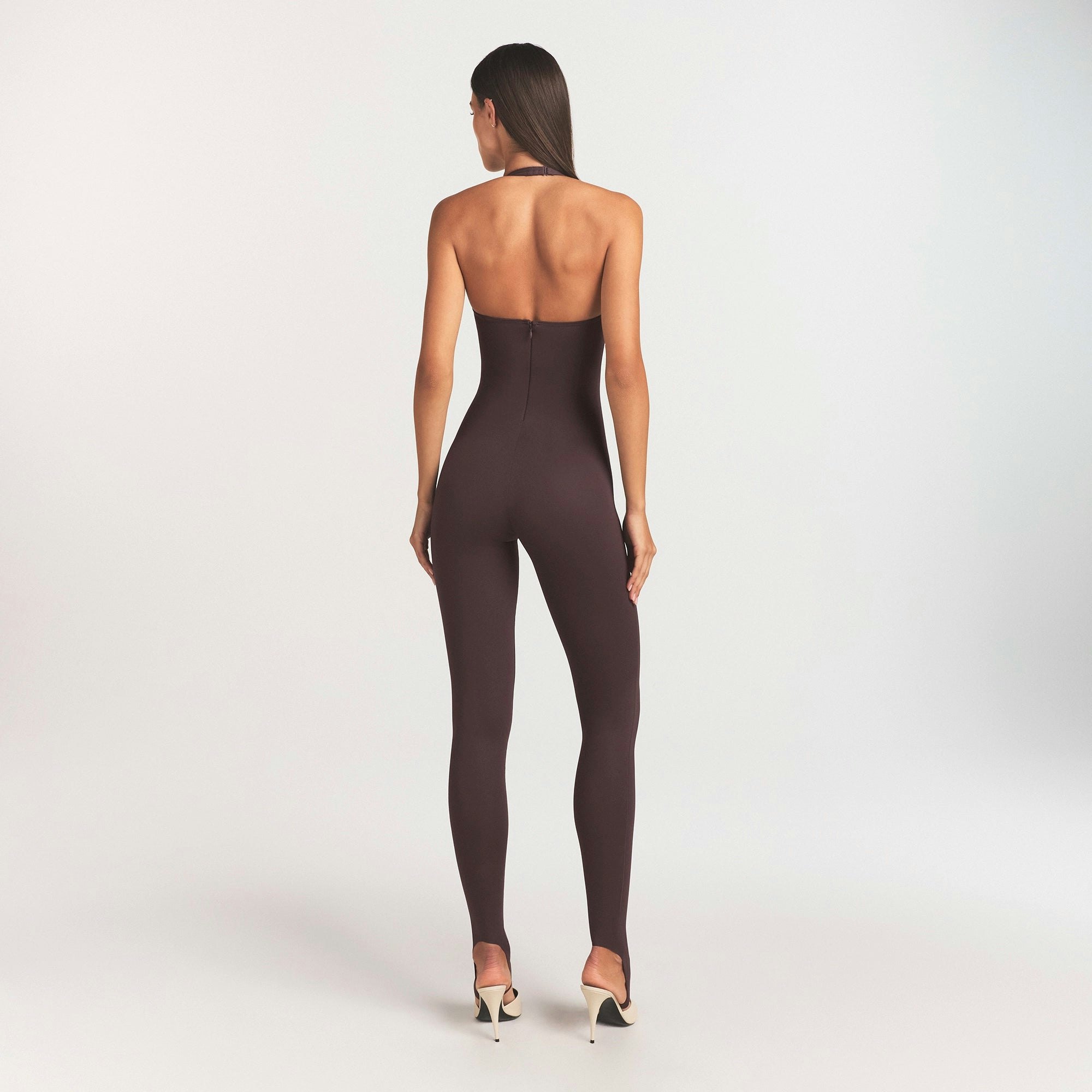 SKIMS BODY HALTER STIRRUP CATSUIT | RAISIN ON A MODEL SIDE VIEW @ | FOCUS: 0.0, 1.0, 0.9