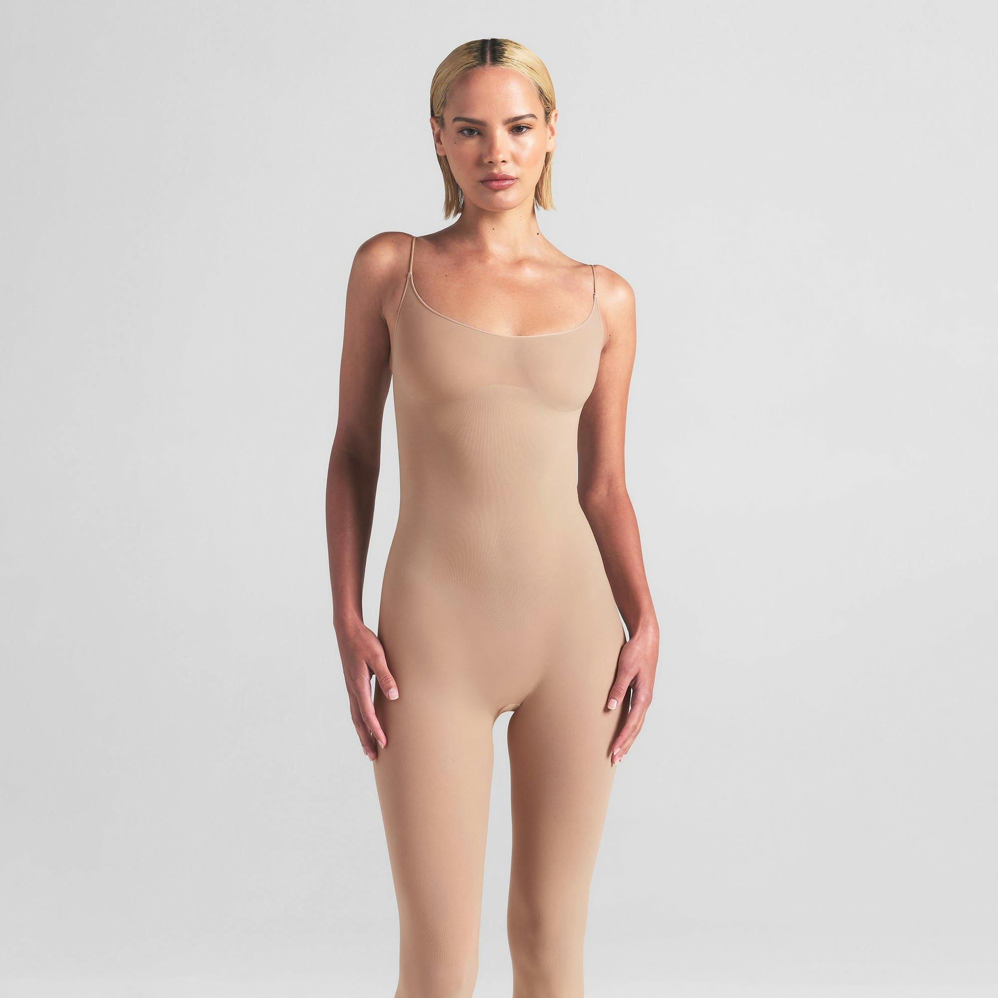 SHEER SEAMLESS CATSUIT | CLAY ON A MODEL FRONT VIEW | FOCUS: 0.0, 1.0, 0.9