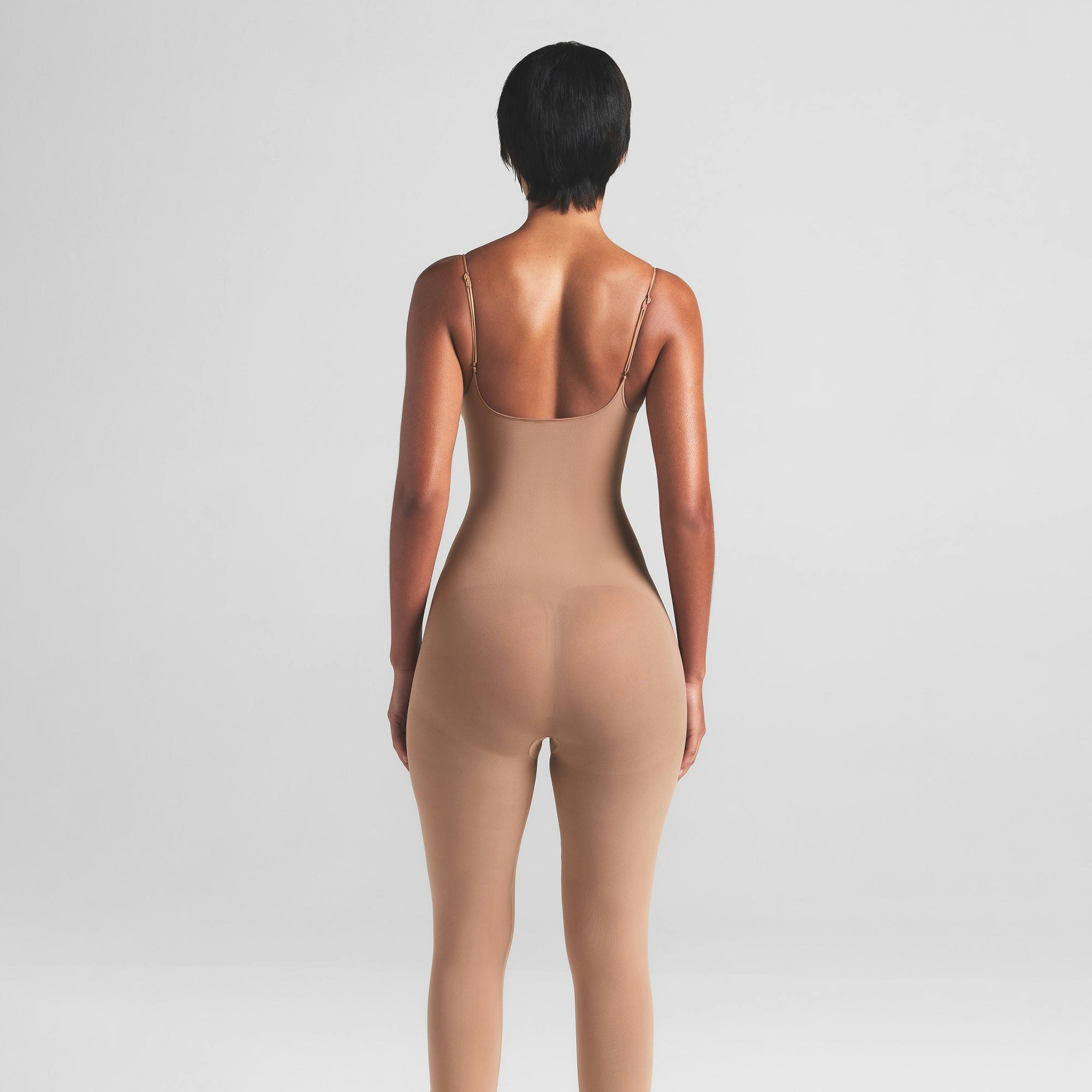 SHEER SEAMLESS CATSUIT | SIENNA ON A MODEL BACK VIEW | FOCUS: 0.0, 1.0, 0.9