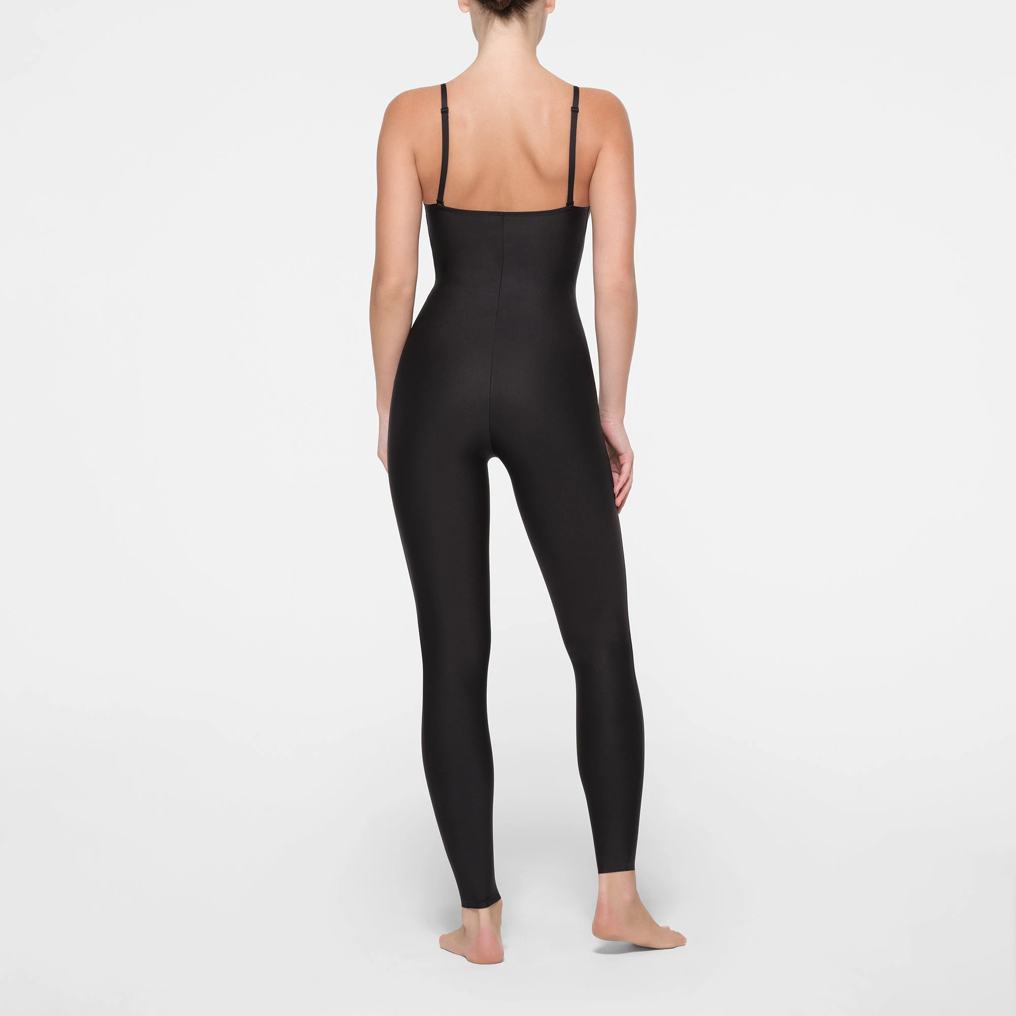 SKIMS BODY PUSH-UP CATSUIT | ONYX ON A MODEL BACK VIEW