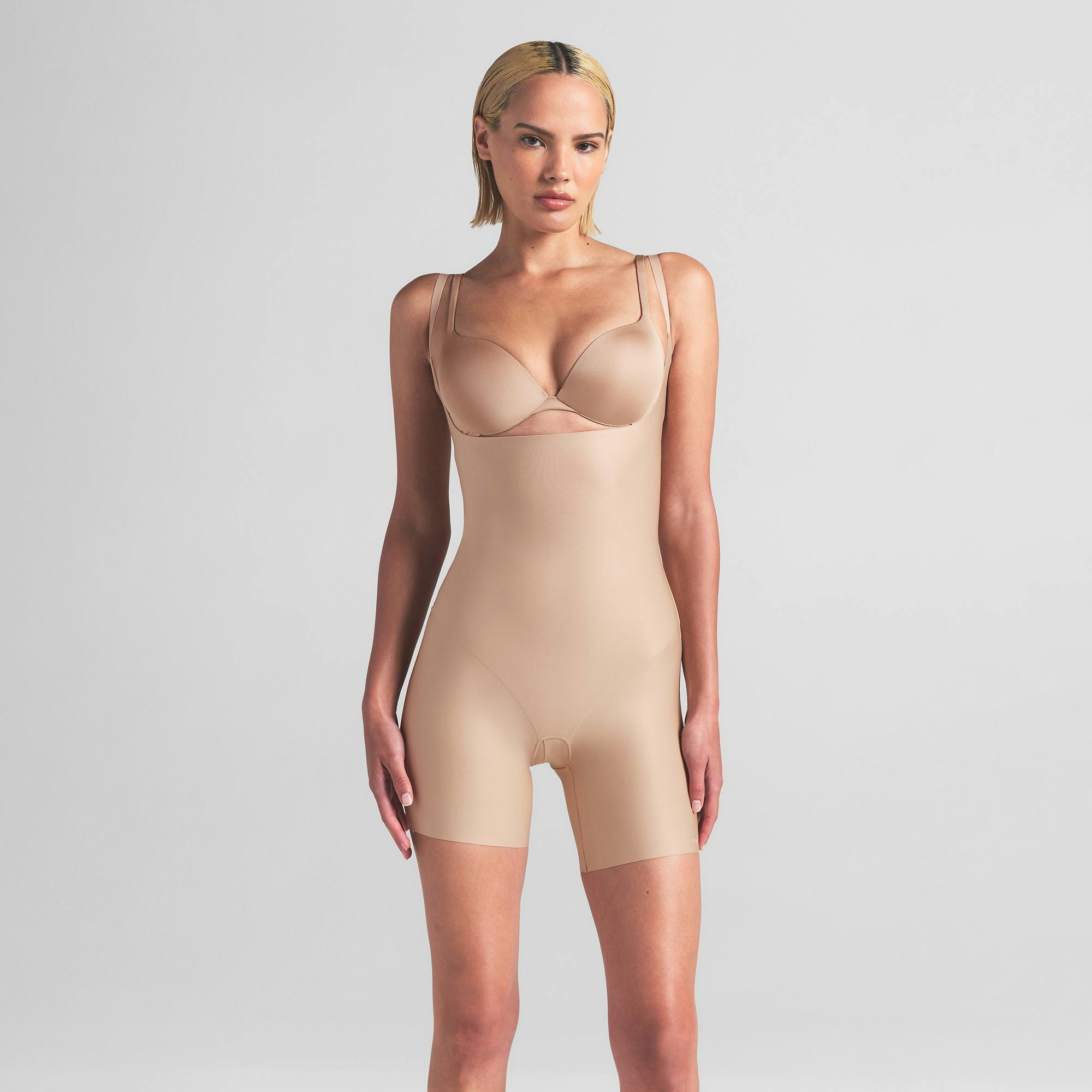 SKIMS BODY CORE SCULPT OPEN BUST MID THIGH BODYSUIT | CLAY ON A MODEL FRONT VIEW | FOCUS: 0.0, 1.0, 0.9