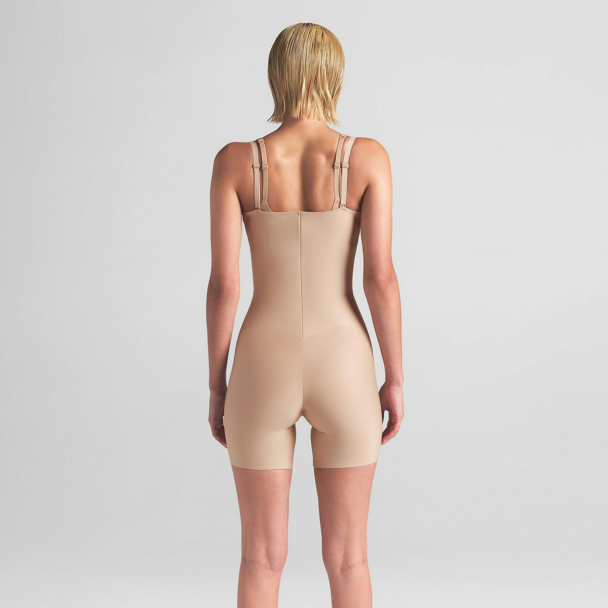 SKIMS BODY CORE SCULPT OPEN BUST MID THIGH BODYSUIT | CLAY ON A MODEL BACK VIEW | FOCUS: 0.0, 1.0, 0.9