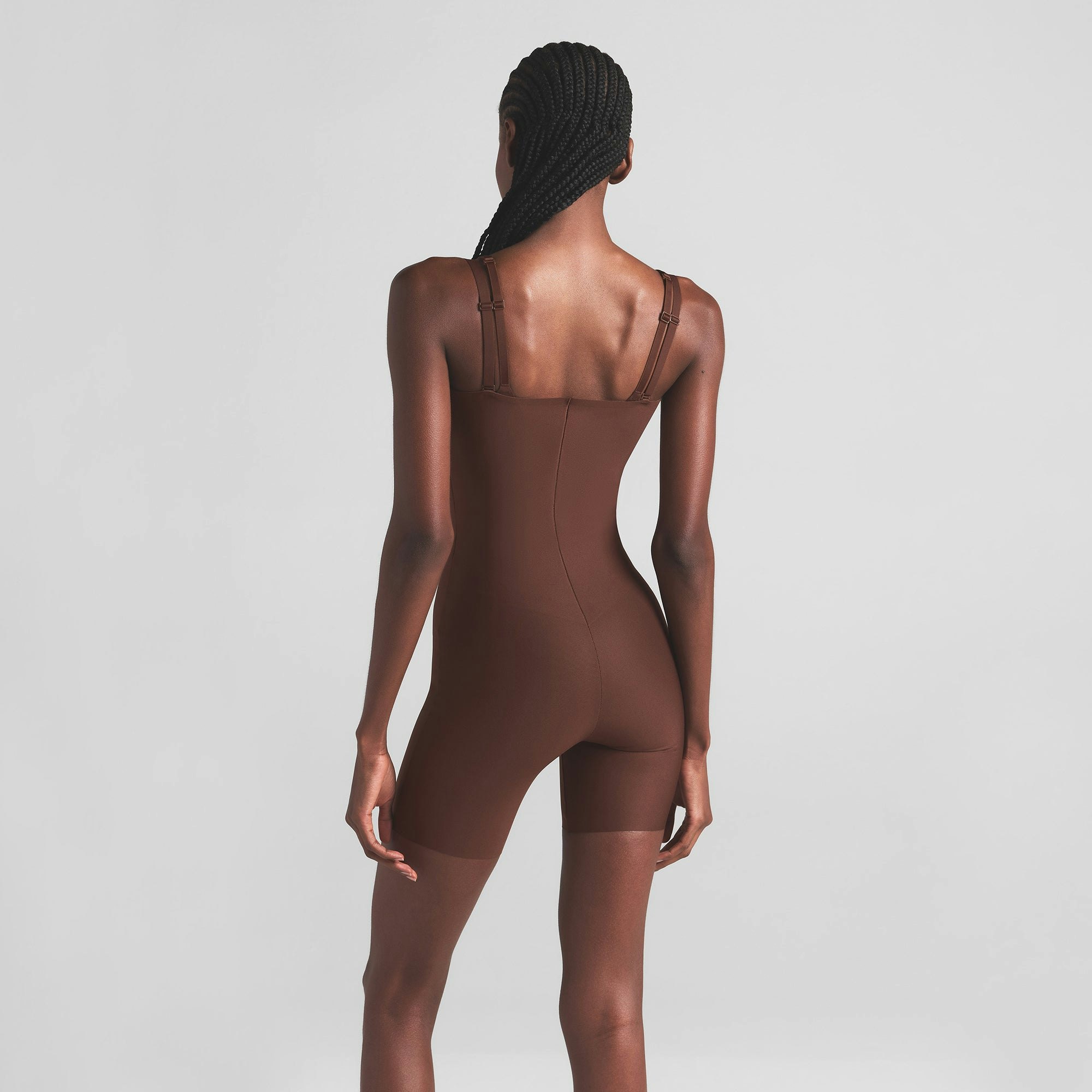 SKIMS BODY CORE SCULPT OPEN BUST MID THIGH BODYSUIT | COCOA ON A MODEL BACK VIEW | FOCUS: 0.0, 1.0, 0.9