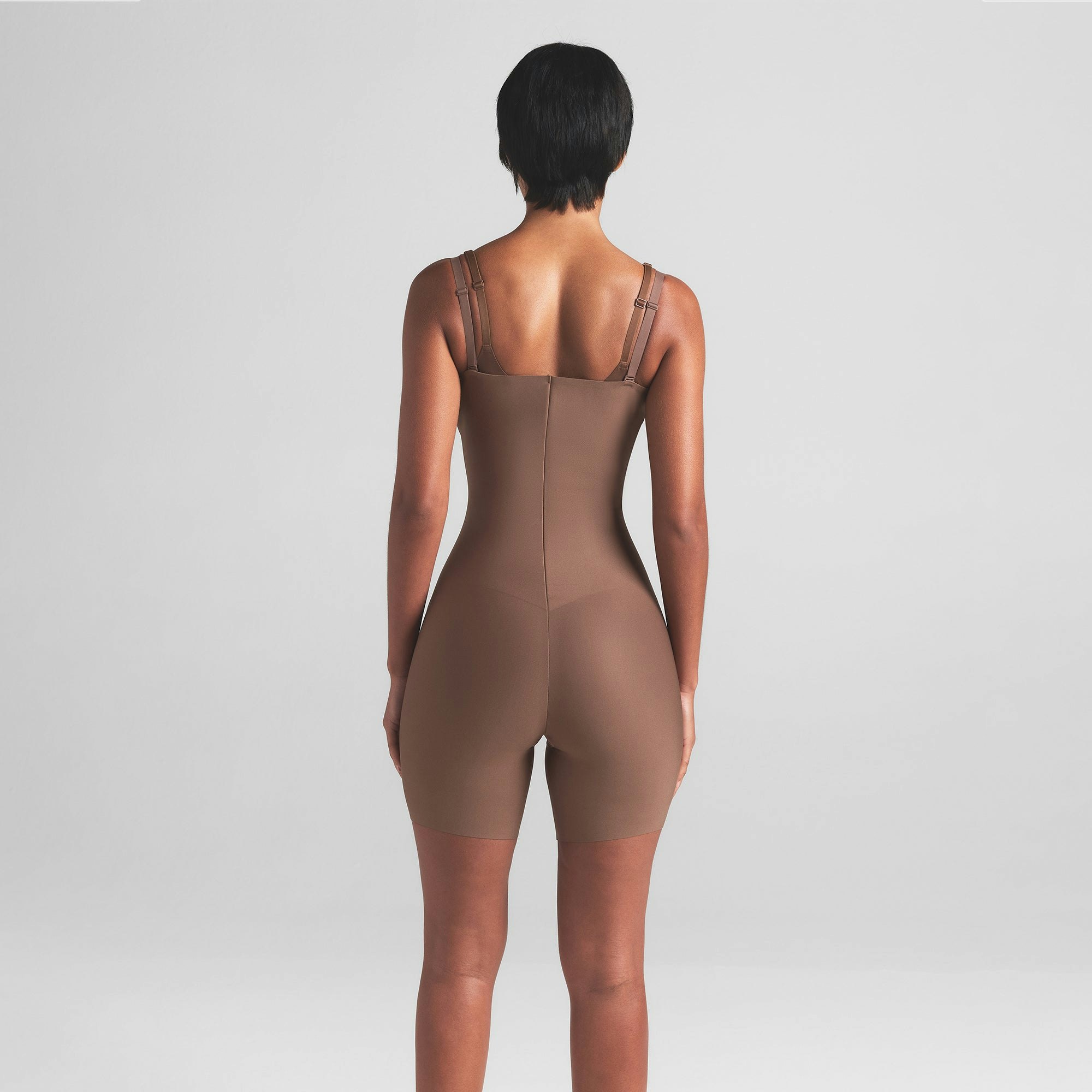 SKIMS BODY CORE SCULPT OPEN BUST MID THIGH BODYSUIT | JASPER ON A MODEL BACK VIEW | FOCUS: 0.0, 1.0, 0.9
