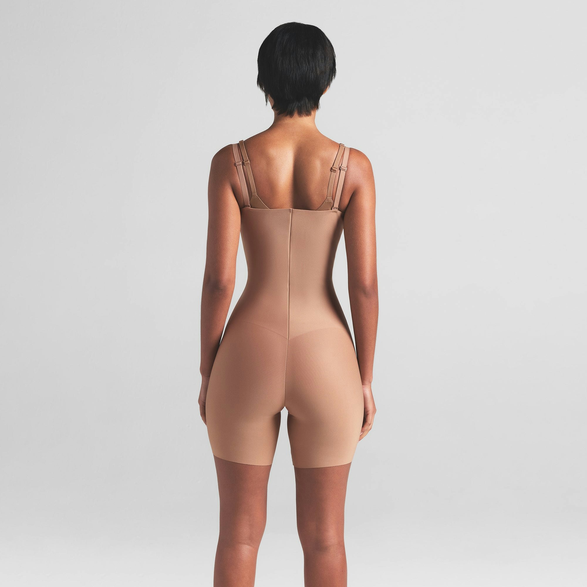 SKIMS BODY CORE SCULPT OPEN BUST MID THIGH BODYSUIT | SIENNA ON A MODEL BACK VIEW | FOCUS: 0.0, 1.0, 0.9