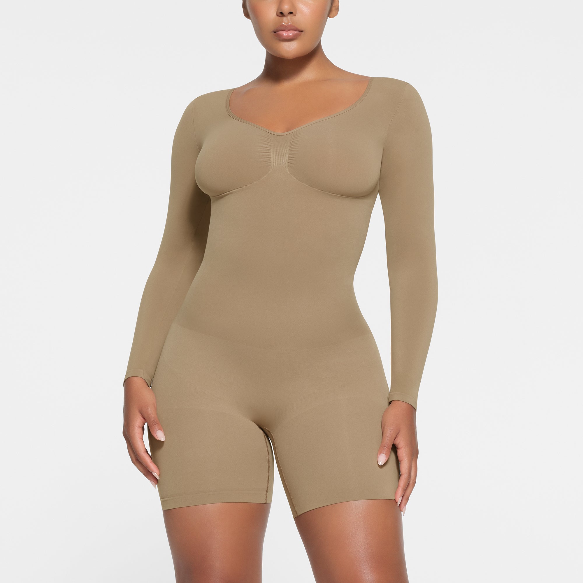 SEAMLESS SCULPT LONG SLEEVE LOW BACK MID THIGH BODYSUIT DESERT XXS