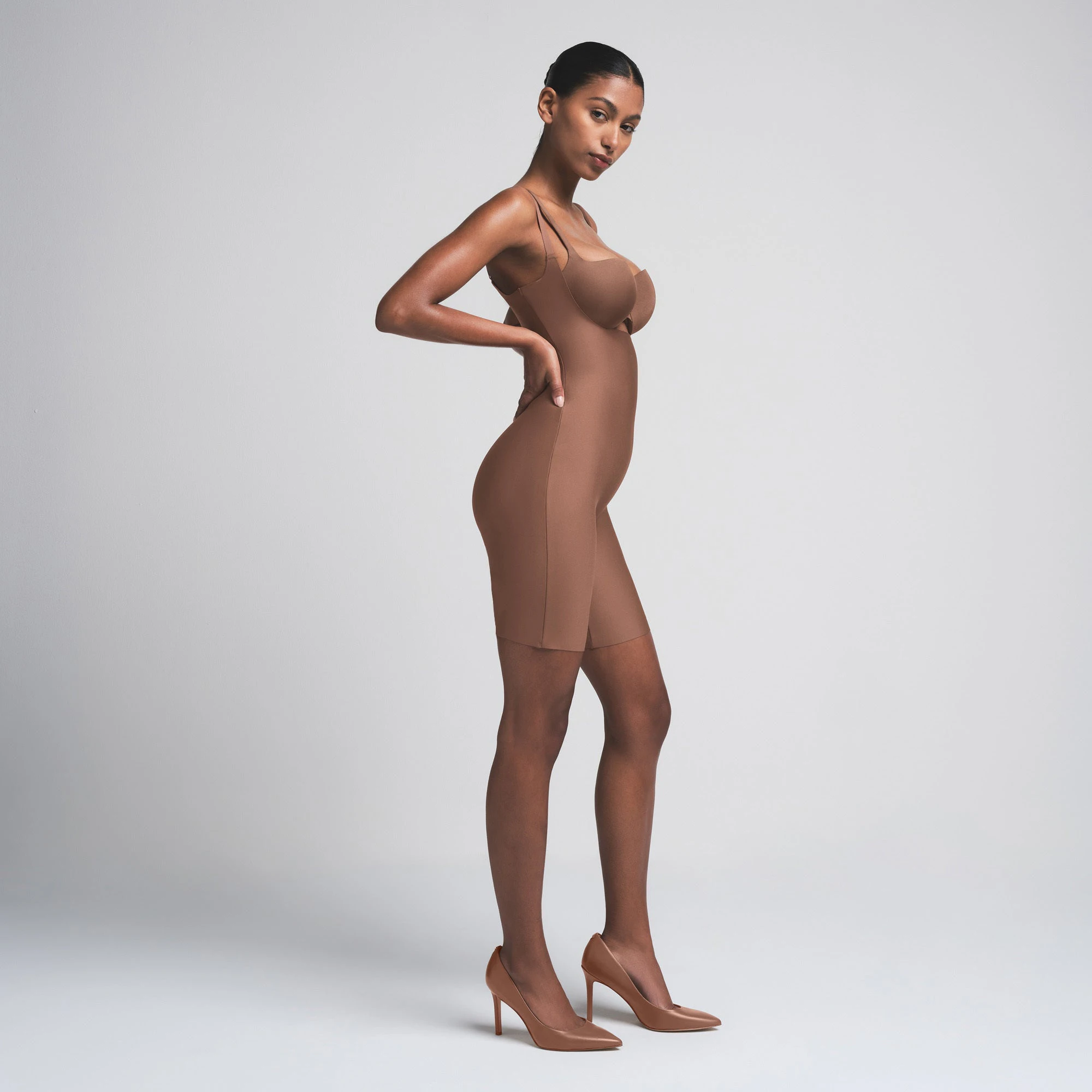 SKIMS BODY BUTT ENHANCING OPEN BUST PADDED BODYSUIT | JASPER ON A MODEL BACK VIEW | FOCUS: 0.0, 1.0, 0.9