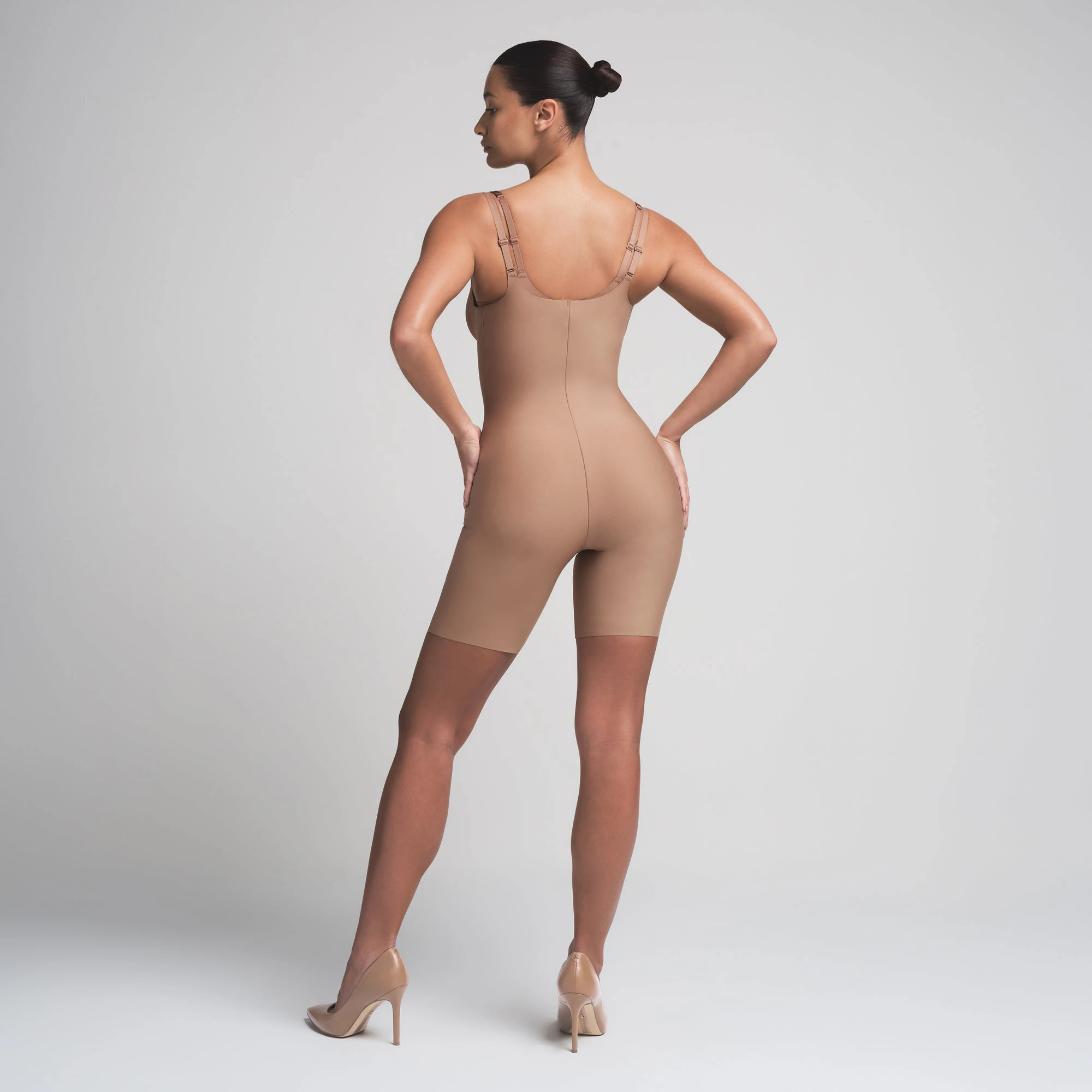 SKIMS BODY BUTT ENHANCING OPEN BUST PADDED BODYSUIT | SIENNA ON A MODEL BACK VIEW | FOCUS: 0.0, 1.0, 0.9