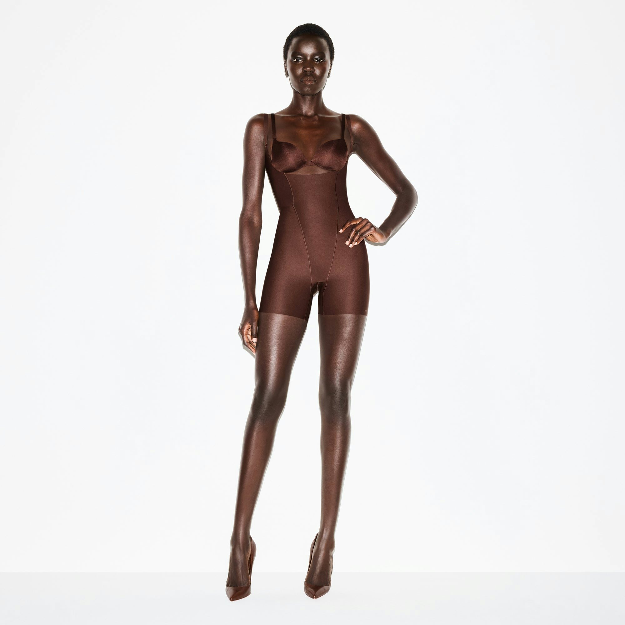 SKIMS BODY CORE SCULPT FUNCTIONAL MID THIGH BODYSUIT | COCOA ON A MODEL FRONT VIEW @ | FOCUS: 0.0, 1.0, 0.9