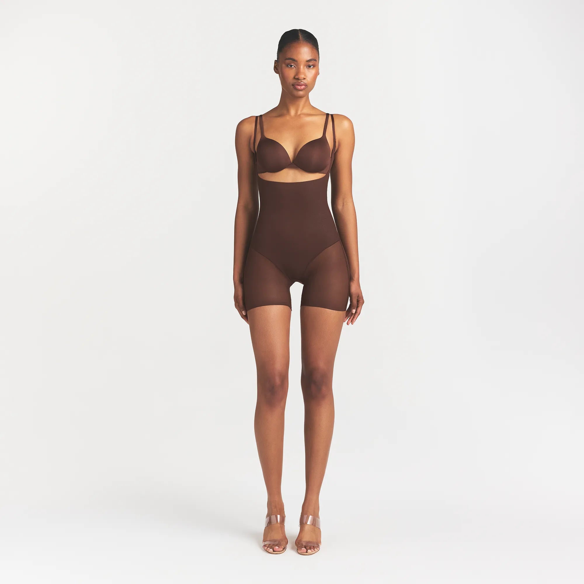 SKIMS BODY CORE SCULPT BACK SMOOTHING OPEN BUST MID THIGH BODYSUIT | COCOA ON A MODEL FRONT VIEW @ | FOCUS: 0.0, 1.0, 0.9
