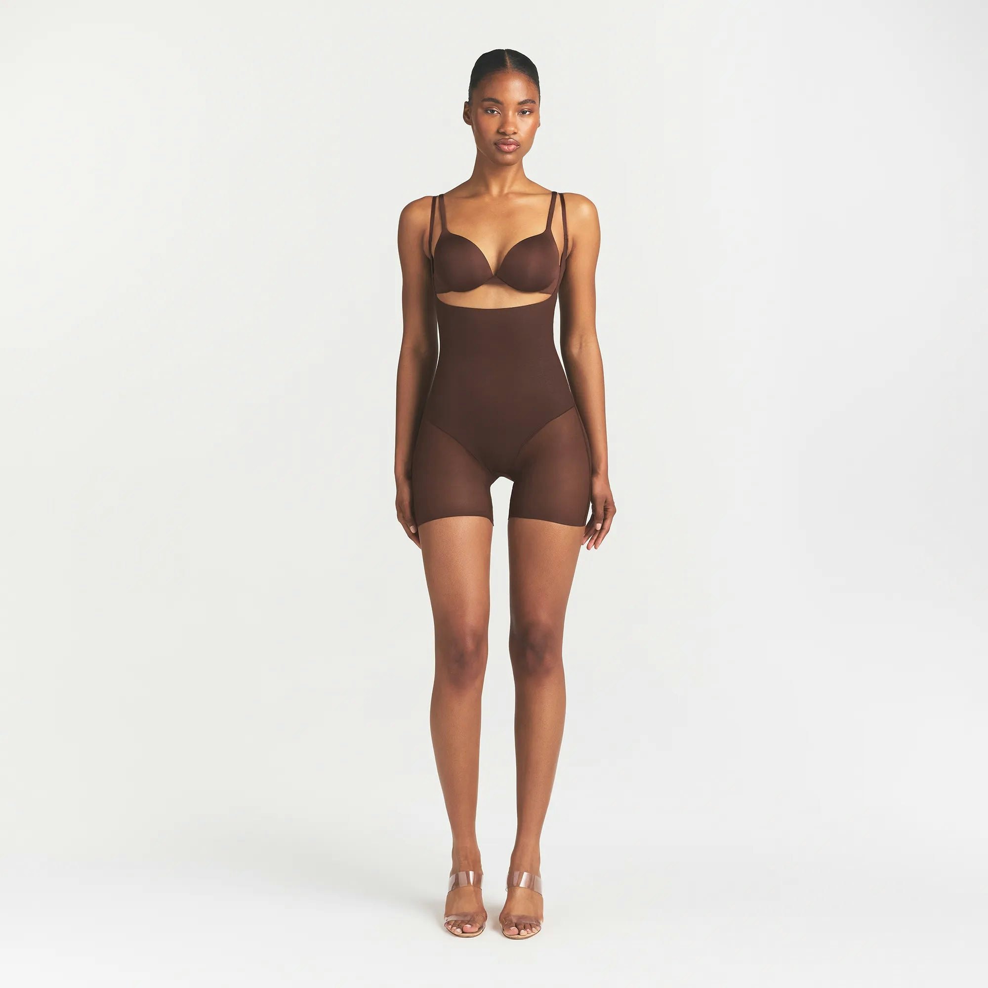 SKIMS BODY CORE SCULPT BACK SMOOTHING OPEN BUST MID THIGH BODYSUIT | COCOA ON A MODEL FRONT VIEW @ | FOCUS: 0.0, 1.0, 0.9