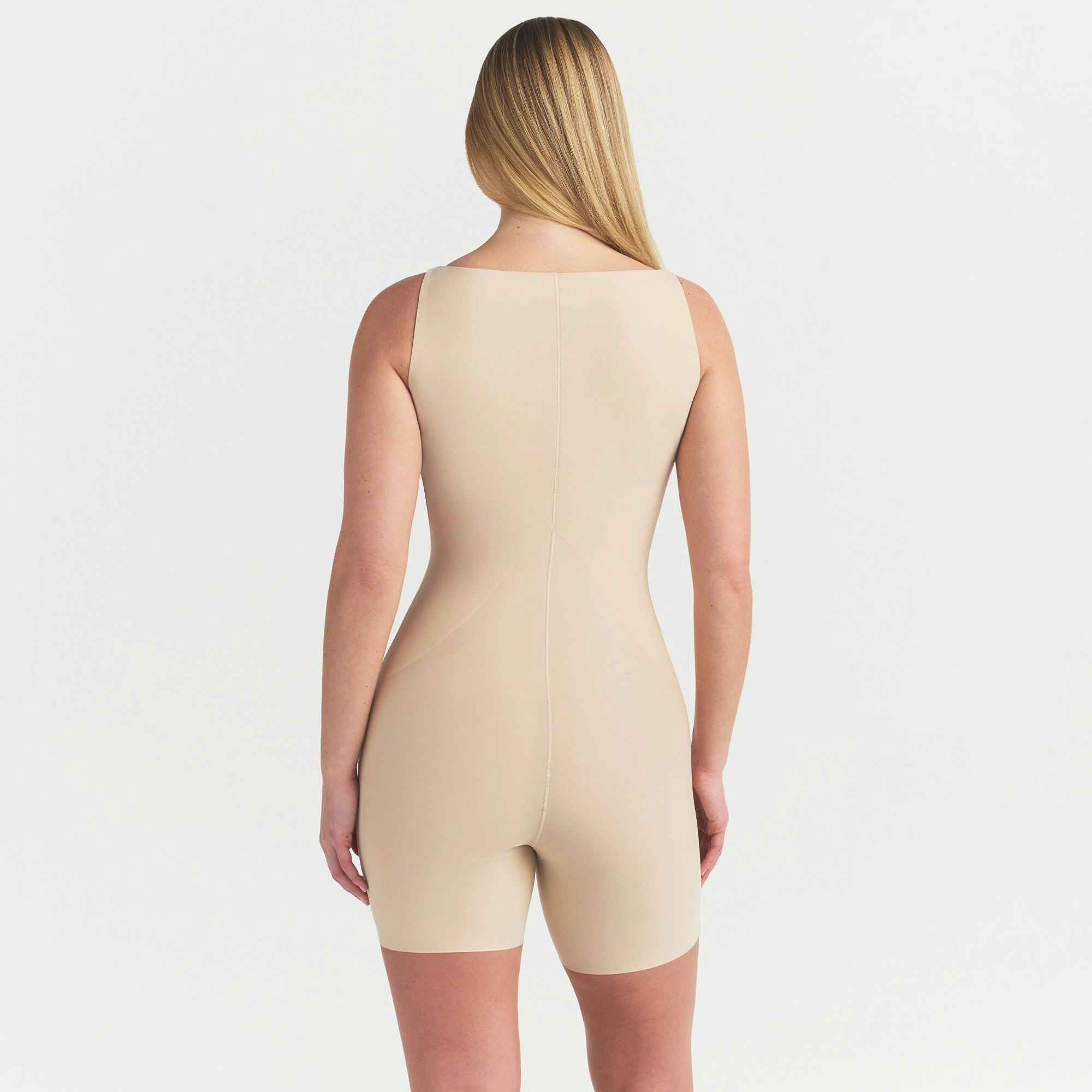 SKIMS BODY CORE SCULPT BACK SMOOTHING OPEN BUST MID THIGH BODYSUIT | SAND ON A MODEL SIDE VIEW @ | FOCUS: 0.0, 1.0, 0.9