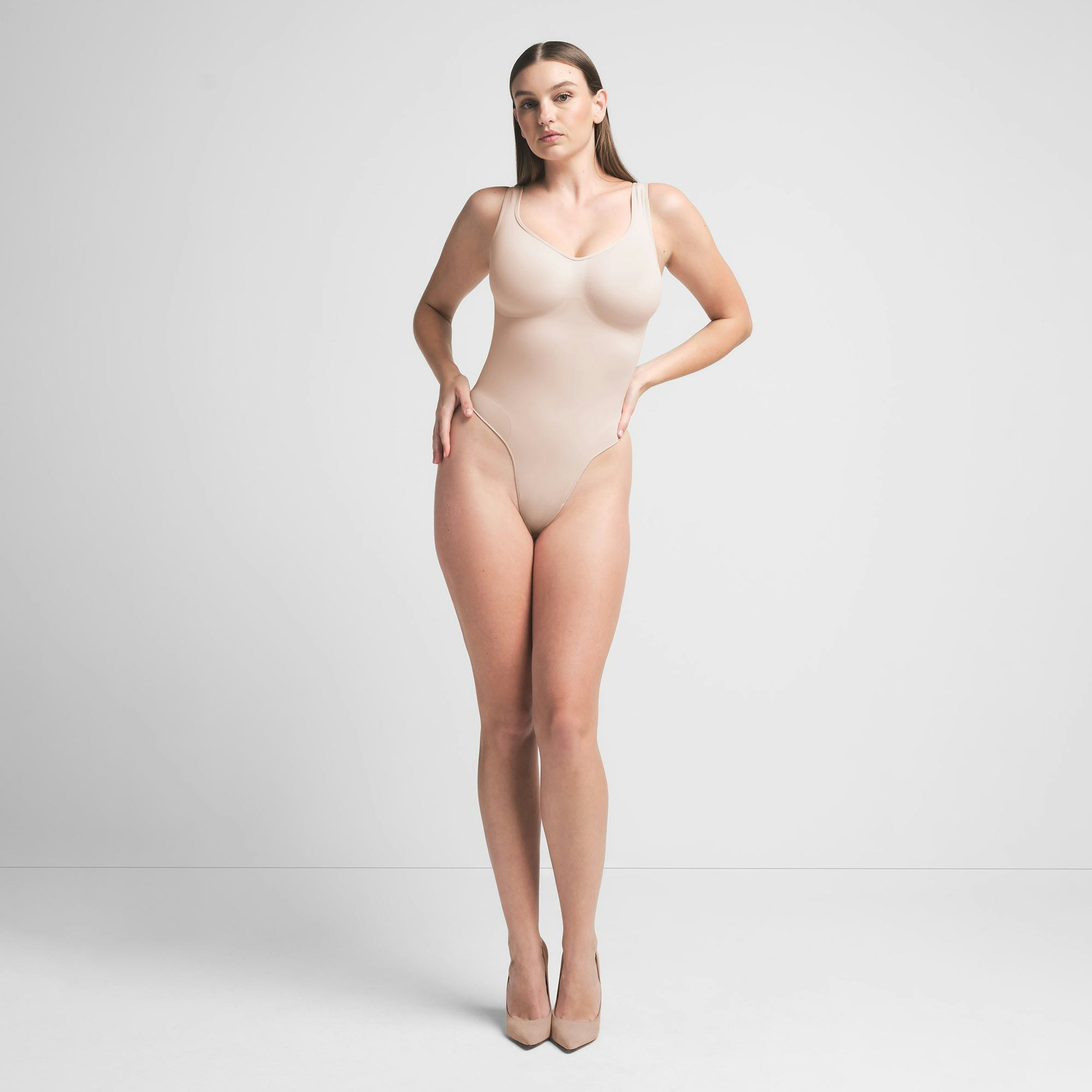SEAMLESS SCULPT SCOOP NECK THONG BODYSUIT | MICA ON A MODEL FRONT VIEW | FOCUS: 0.0, 1.0, 0.9