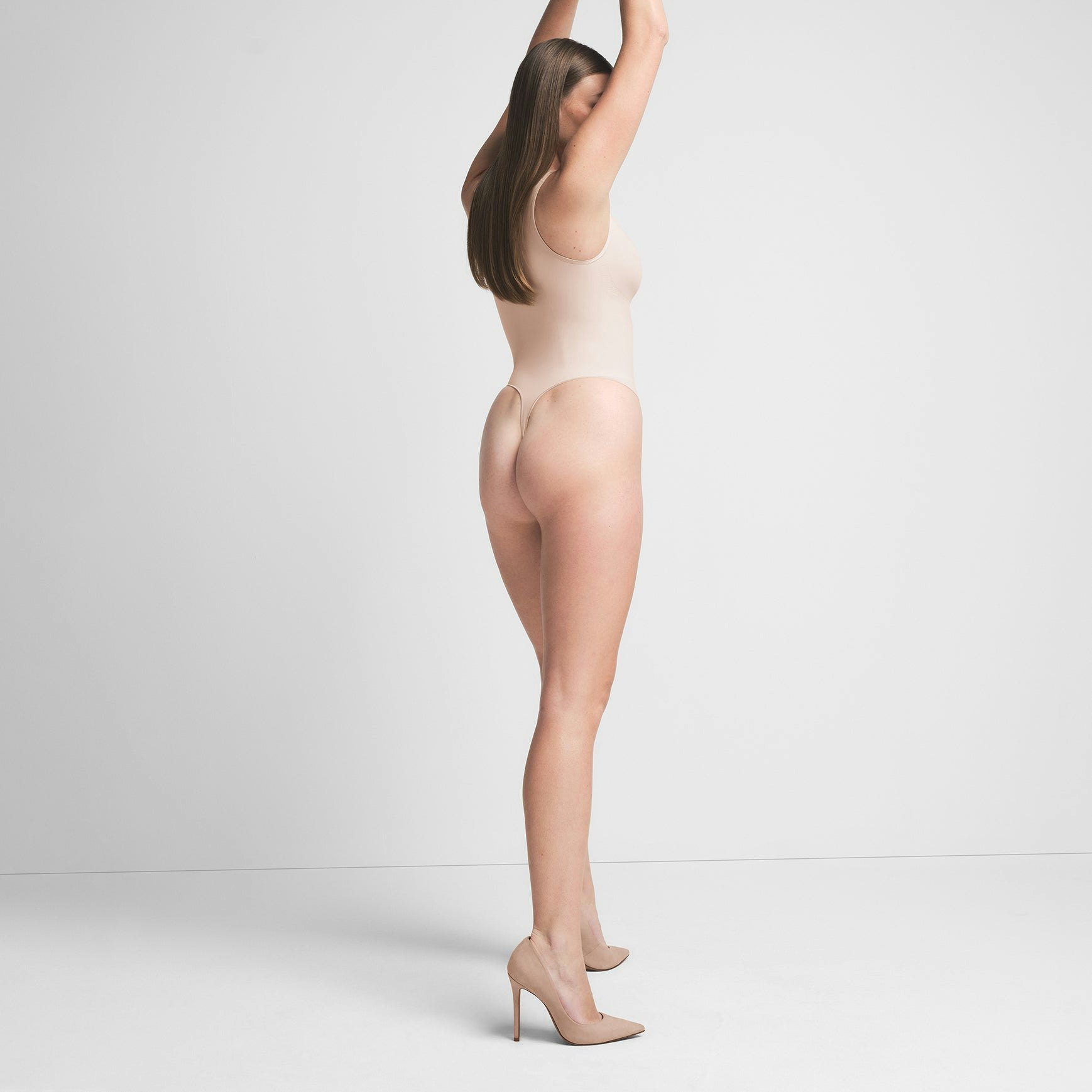 SEAMLESS SCULPT SCOOP NECK THONG BODYSUIT | MICA ON A MODEL BACK VIEW | FOCUS: 0.0, 1.0, 0.9