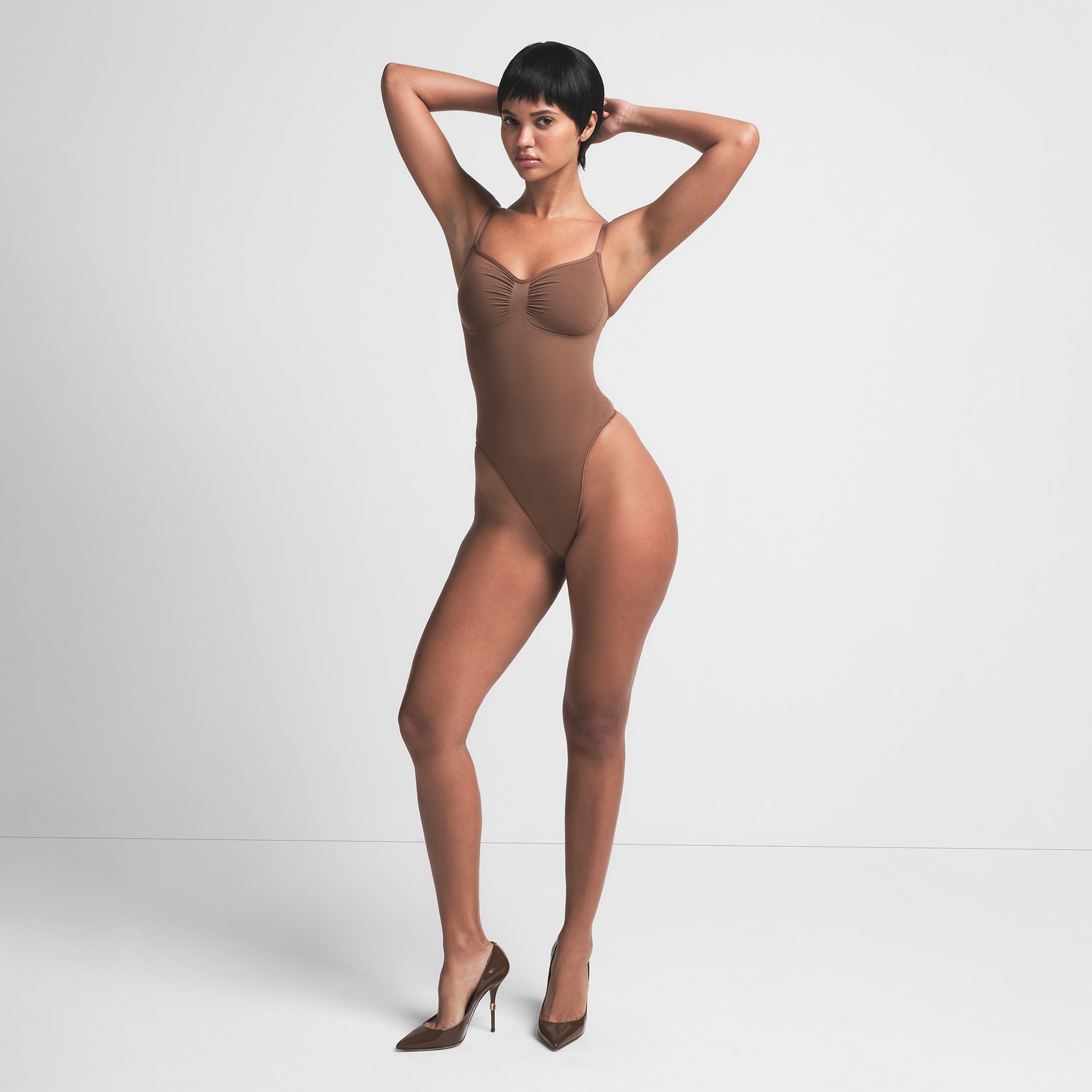 SEAMLESS SCULPT THONG BODYSUIT | JASPER ON A MODEL FRONT VIEW | FOCUS: 0.0, 1.0, 0.9