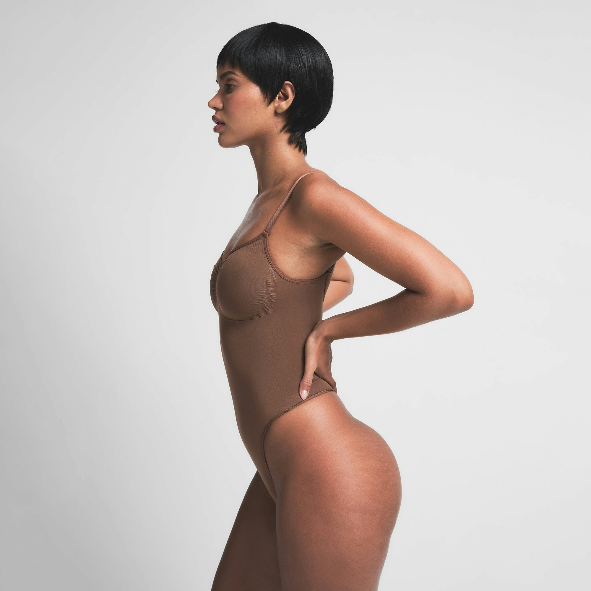 SEAMLESS SCULPT THONG BODYSUIT | JASPER ON A MODEL SIDE VIEW | FOCUS: 0.0, 1.0, 0.9