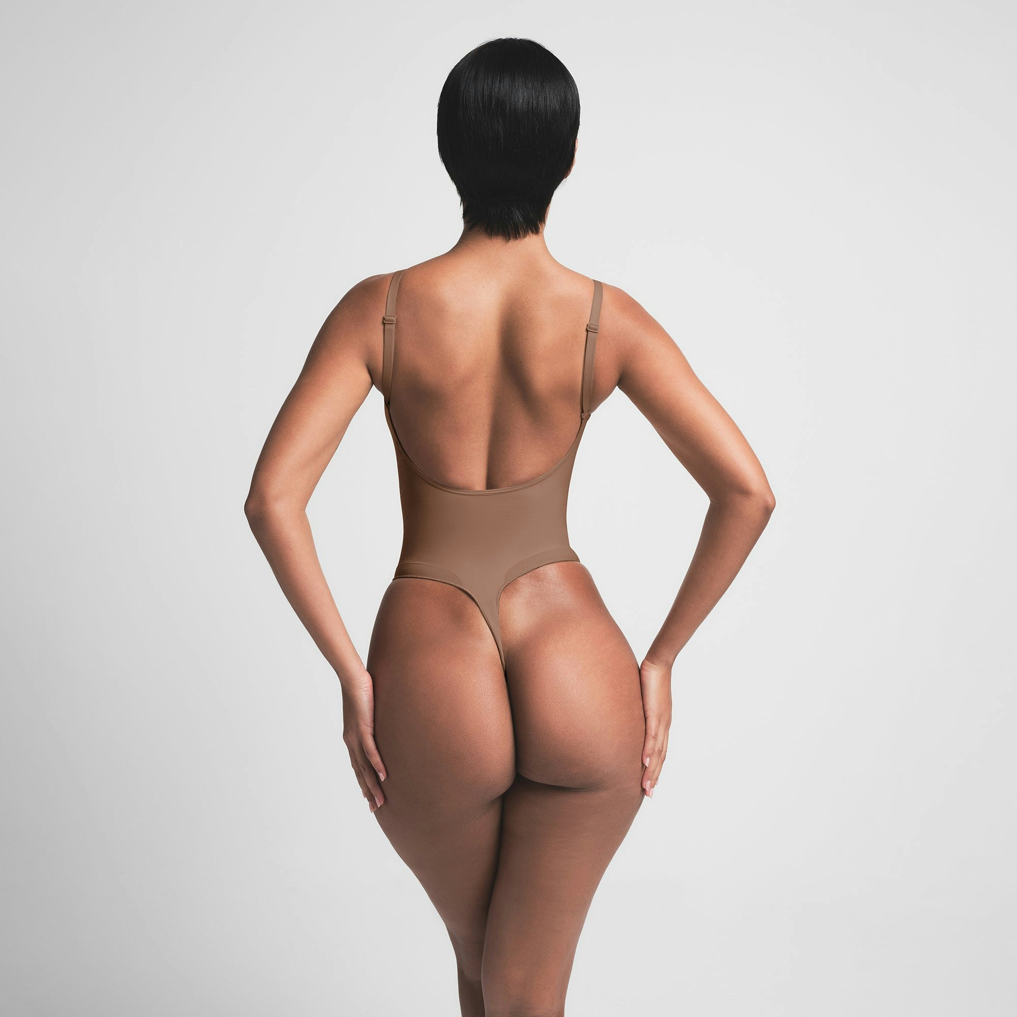 SEAMLESS SCULPT LOW BACK THONG BODYSUIT | JASPER ON A MODEL BACK VIEW | FOCUS: 0.0, 1.0, 0.9
