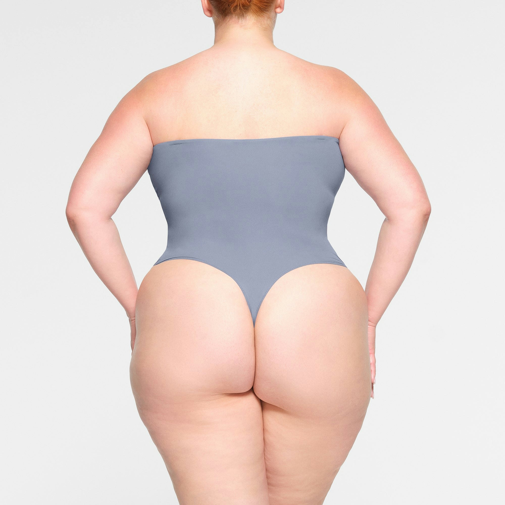 FITS EVERYBODY STRAPLESS BODYSUIT WORN BY A MODEL IN BACK VIEW