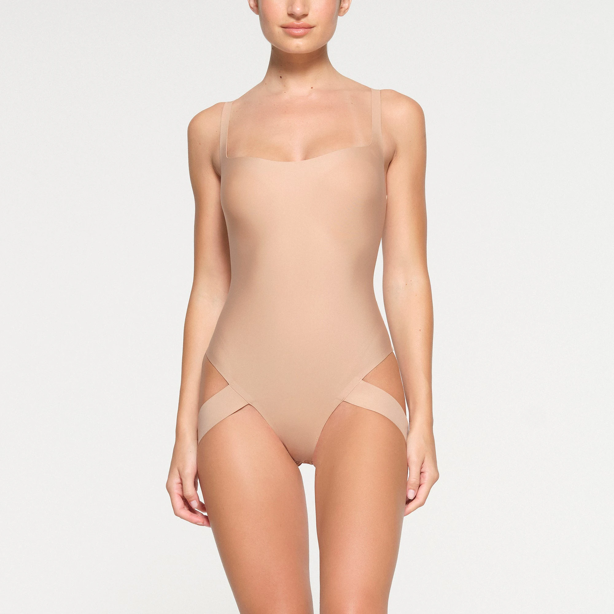 SKIMS BODY LIFTING BODYSUIT WORN BY A MODEL IN FRONT VIEW