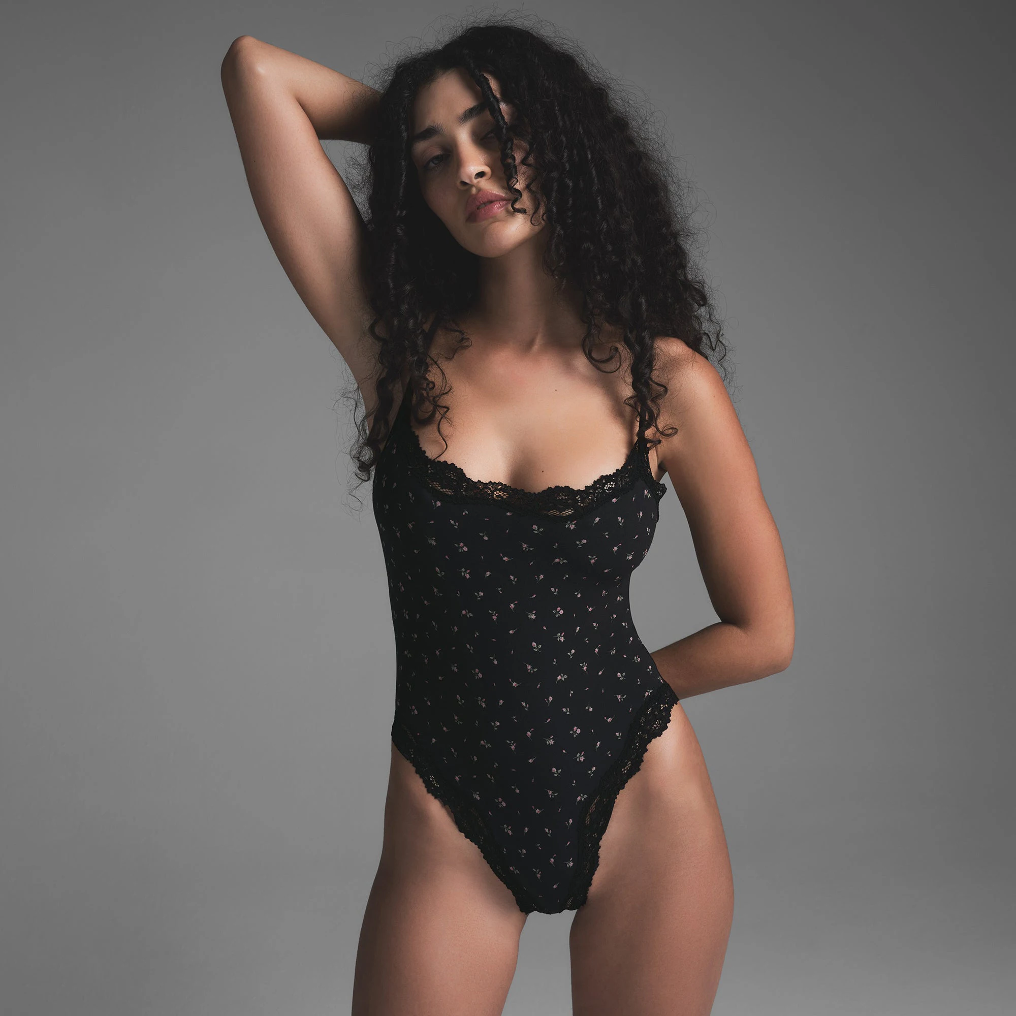 FITS EVERYBODY LACE CAMI BODYSUIT | ONYX ROSEBUD PRINT ON A MODEL FRONT VIEW | FOCUS: 0.0, 1.0, 0.9