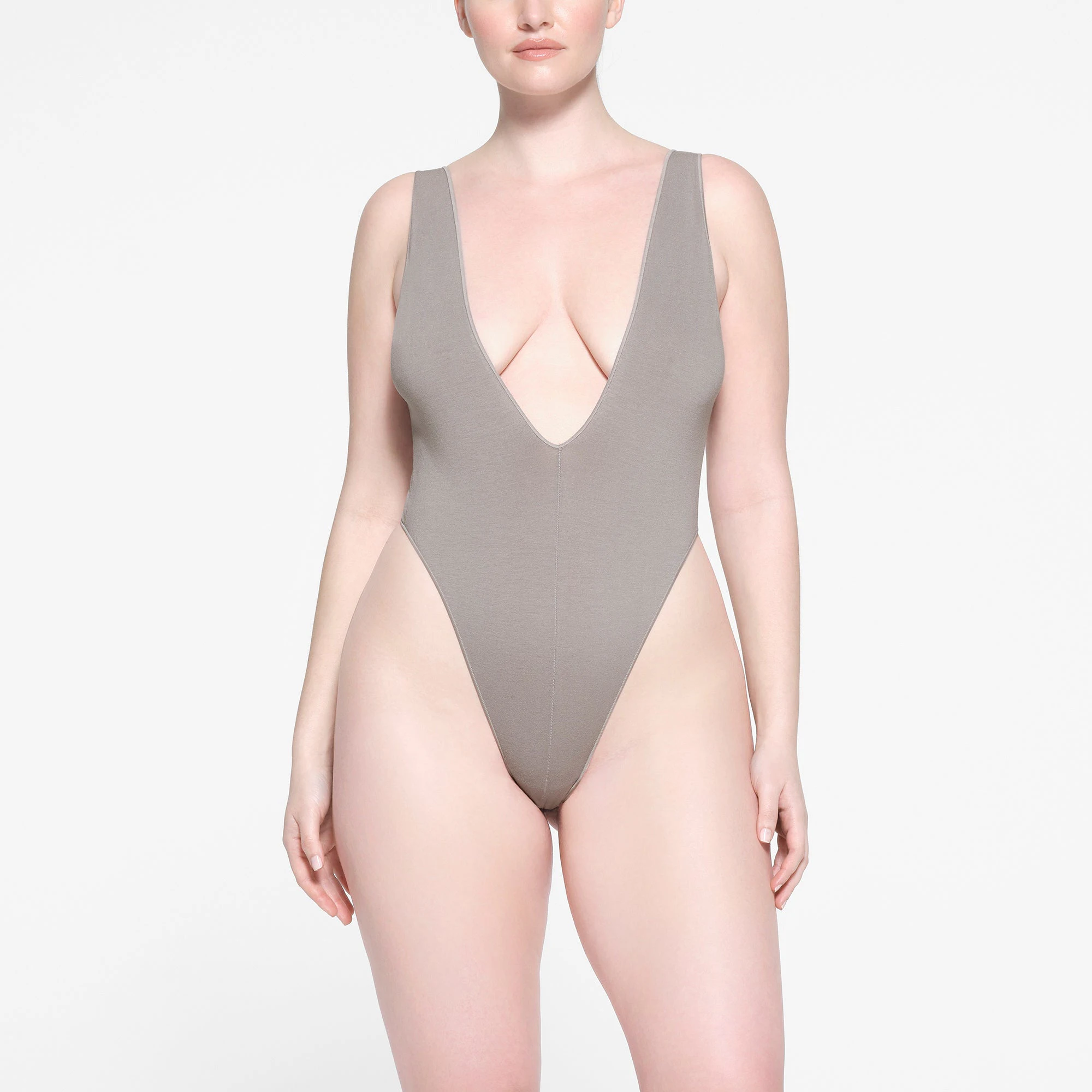 SEAMLESS MODAL DEEP PLUNGE BODYSUIT | SMOKE ON A MODEL FRONT VIEW