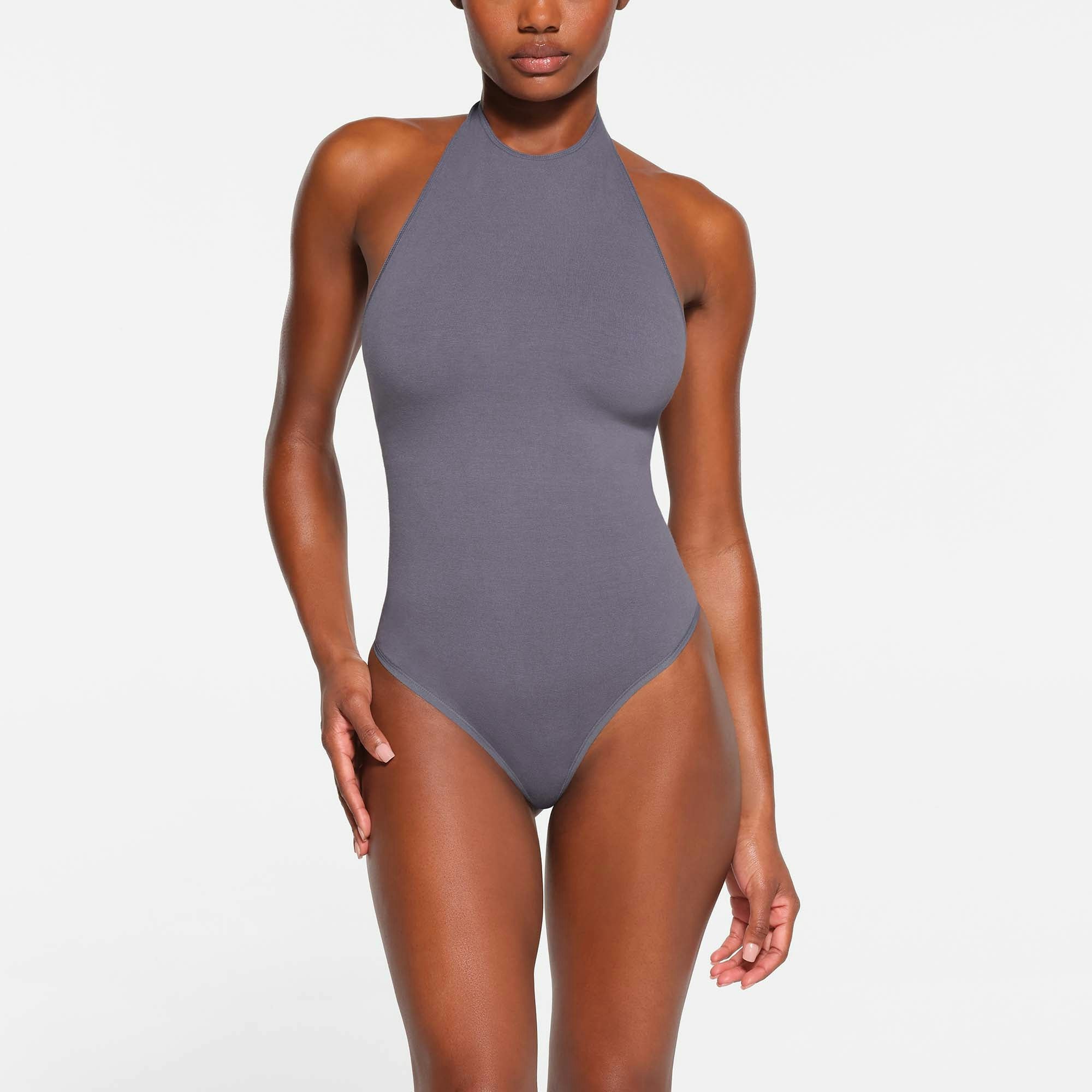 OUTDOOR HALTER BODYSUIT | STEEL BLUE ON A MODEL FRONT VIEW