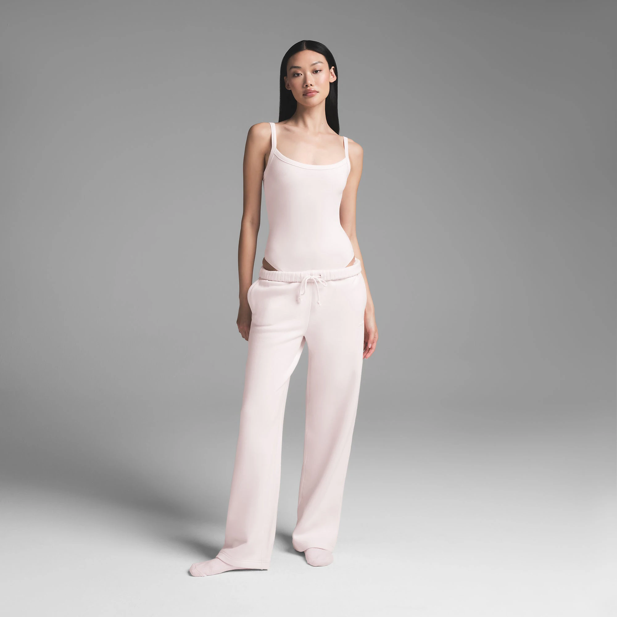 COTTON JERSEY SCOOP NECK BODYSUIT | BARELY PINK ON A MODEL FRONT VIEW | FOCUS: 0.0, 1.0, 0.9