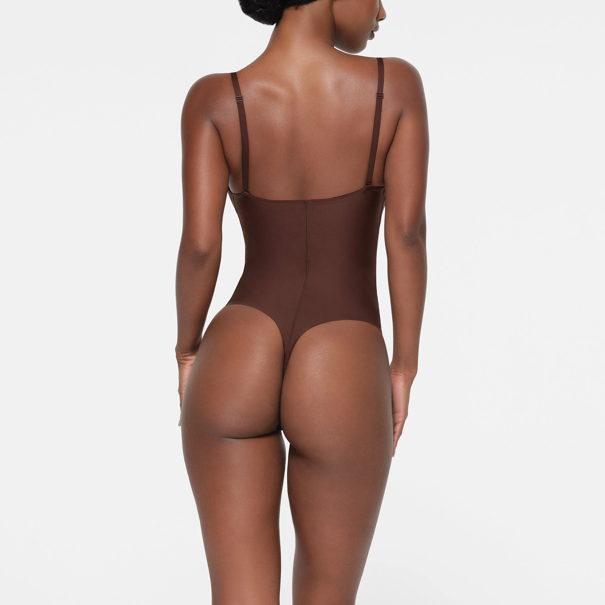 SKIMS BODY PUSH-UP THONG BODYSUIT | COCOA ON A MODEL BACK VIEW