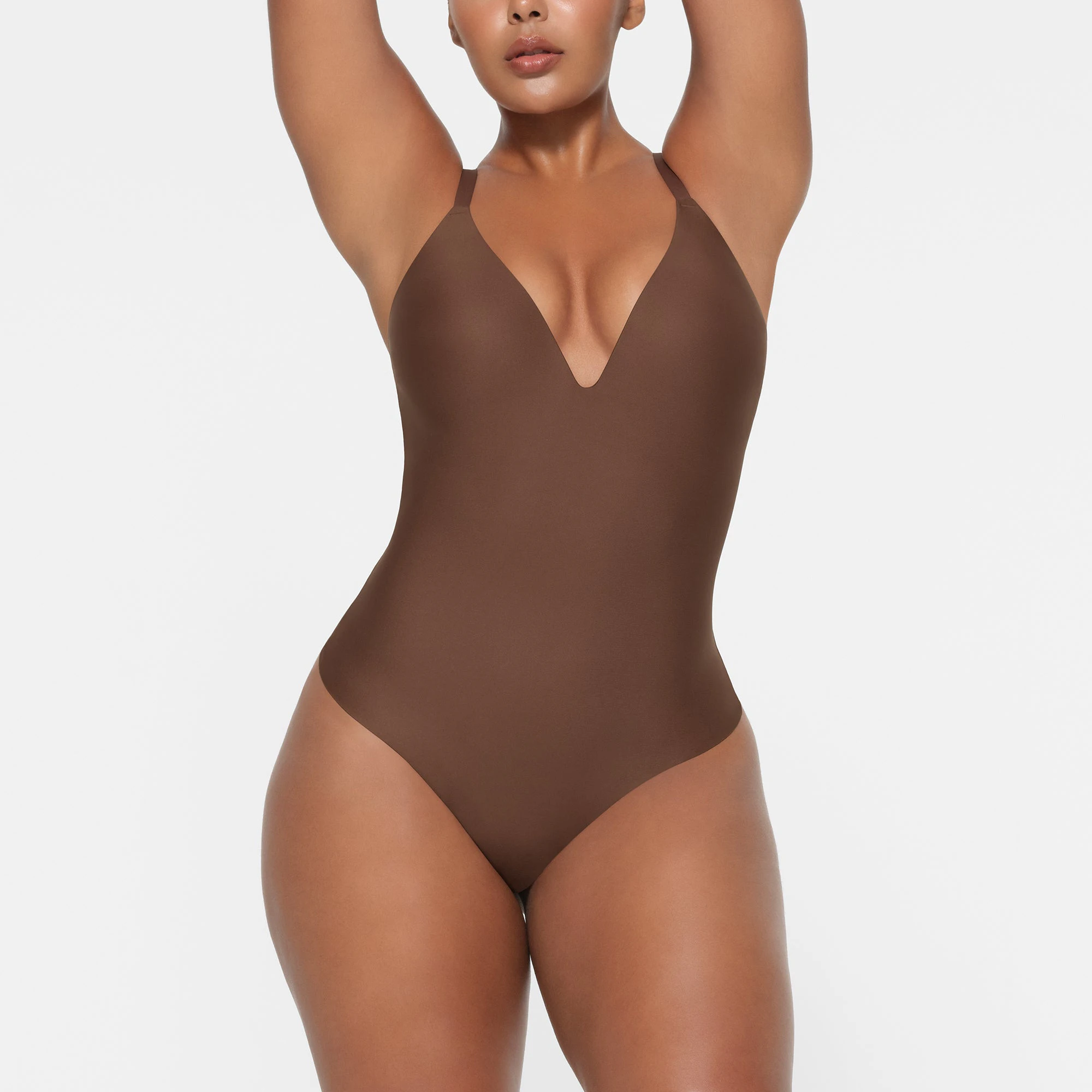 SKIMS BODY PUSH-UP THONG BODYSUIT | JASPER ON A MODEL FRONT VIEW
