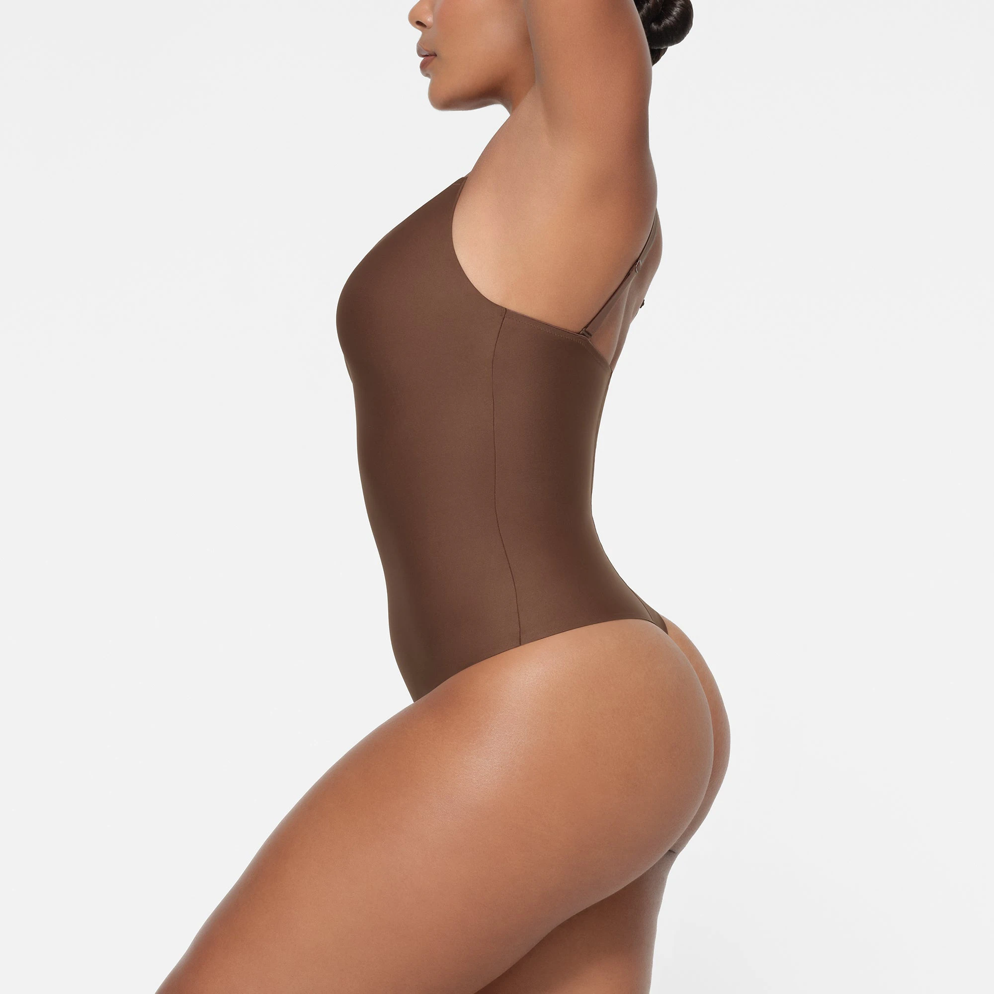 SKIMS BODY PUSH-UP THONG BODYSUIT | JASPER ON A MODEL SIDE VIEW