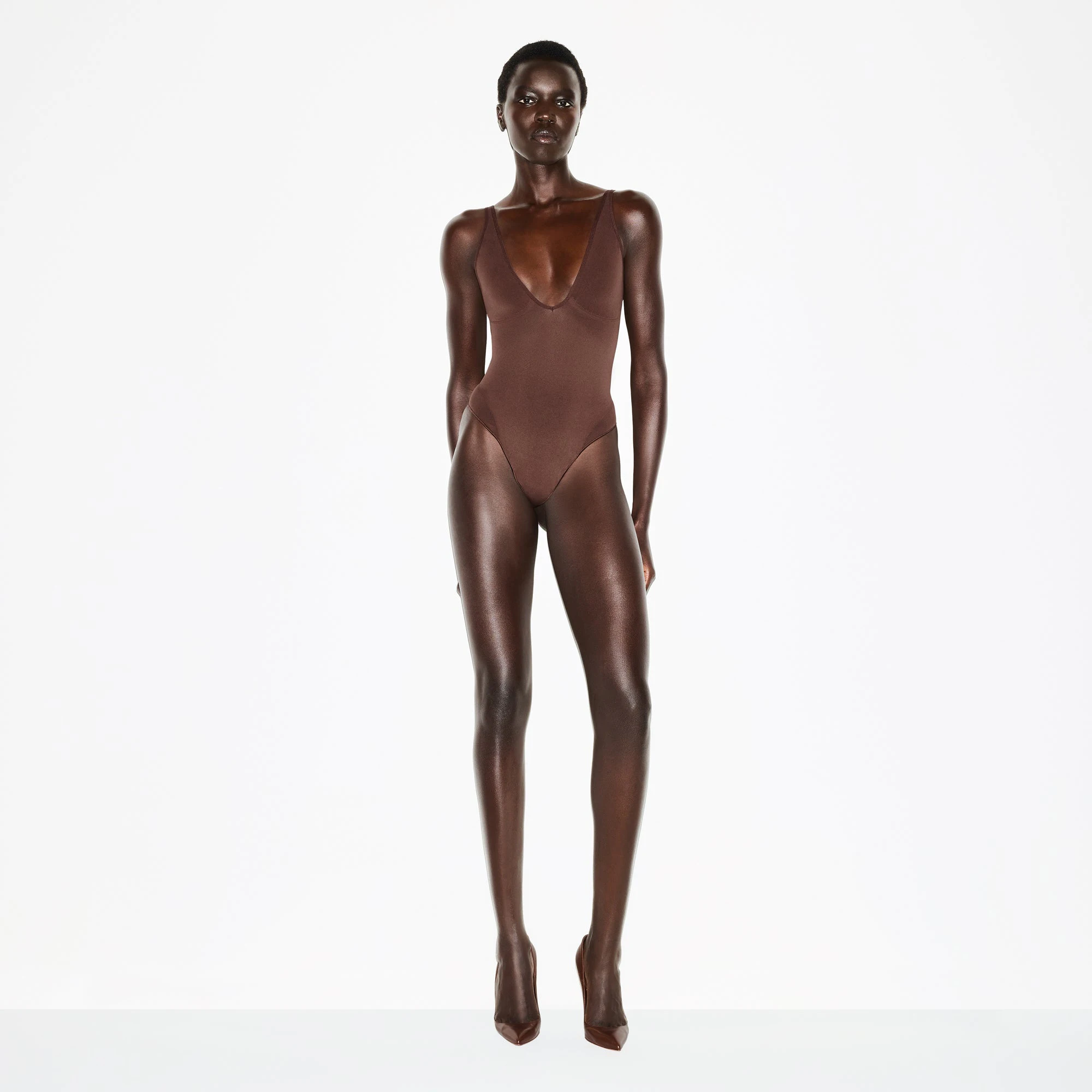 SEAMLESS SCULPT DEEP PLUNGE THONG BODYSUIT | COCOA ON A MODEL FRONT VIEW @ | FOCUS: 0.0, 1.0, 0.9