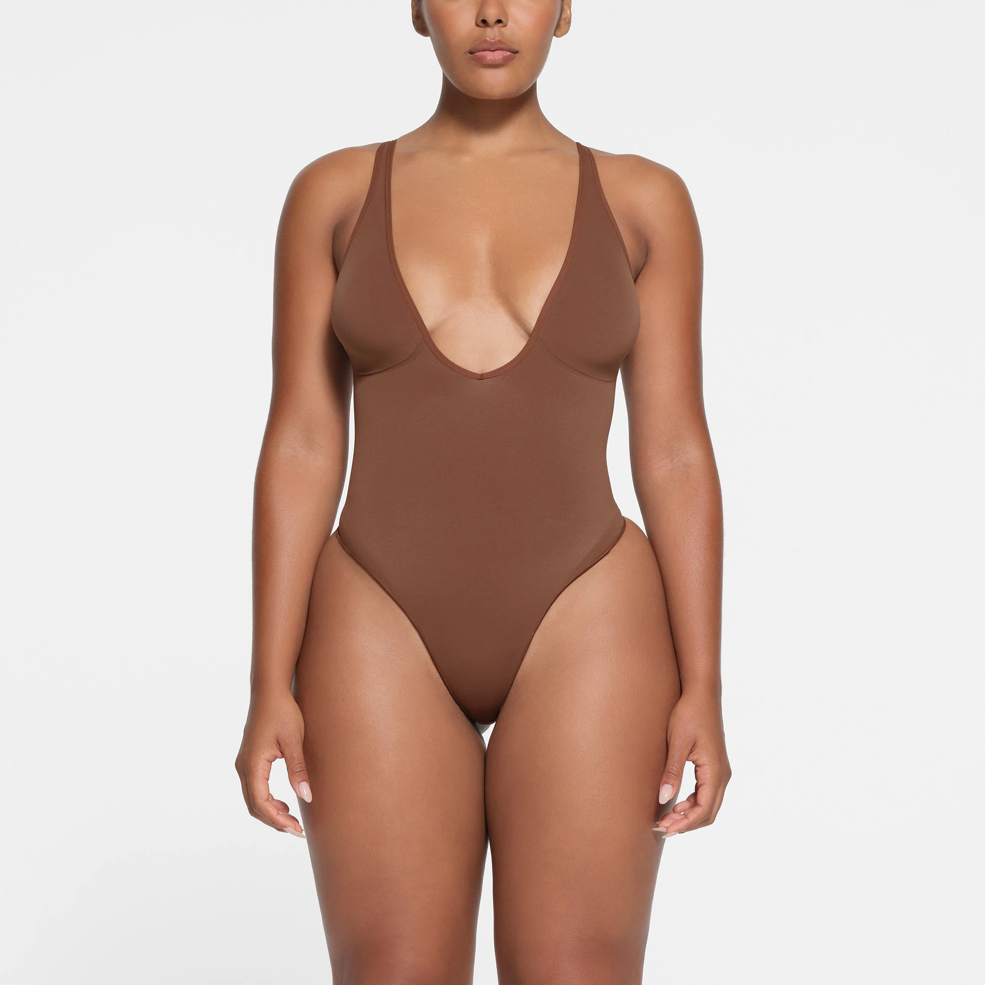 SEAMLESS SCULPT DEEP PLUNGE THONG BODYSUIT | JASPER ON A MODEL FRONT VIEW