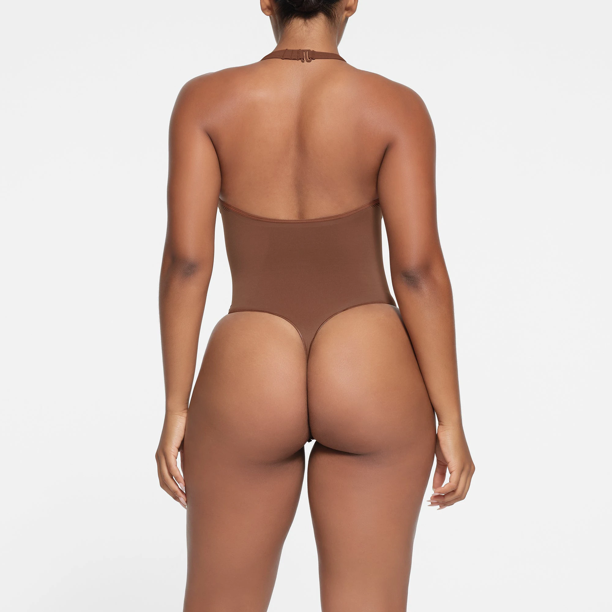 SEAMLESS SCULPT DEEP PLUNGE THONG BODYSUIT | JASPER ON A MODEL BACK VIEW